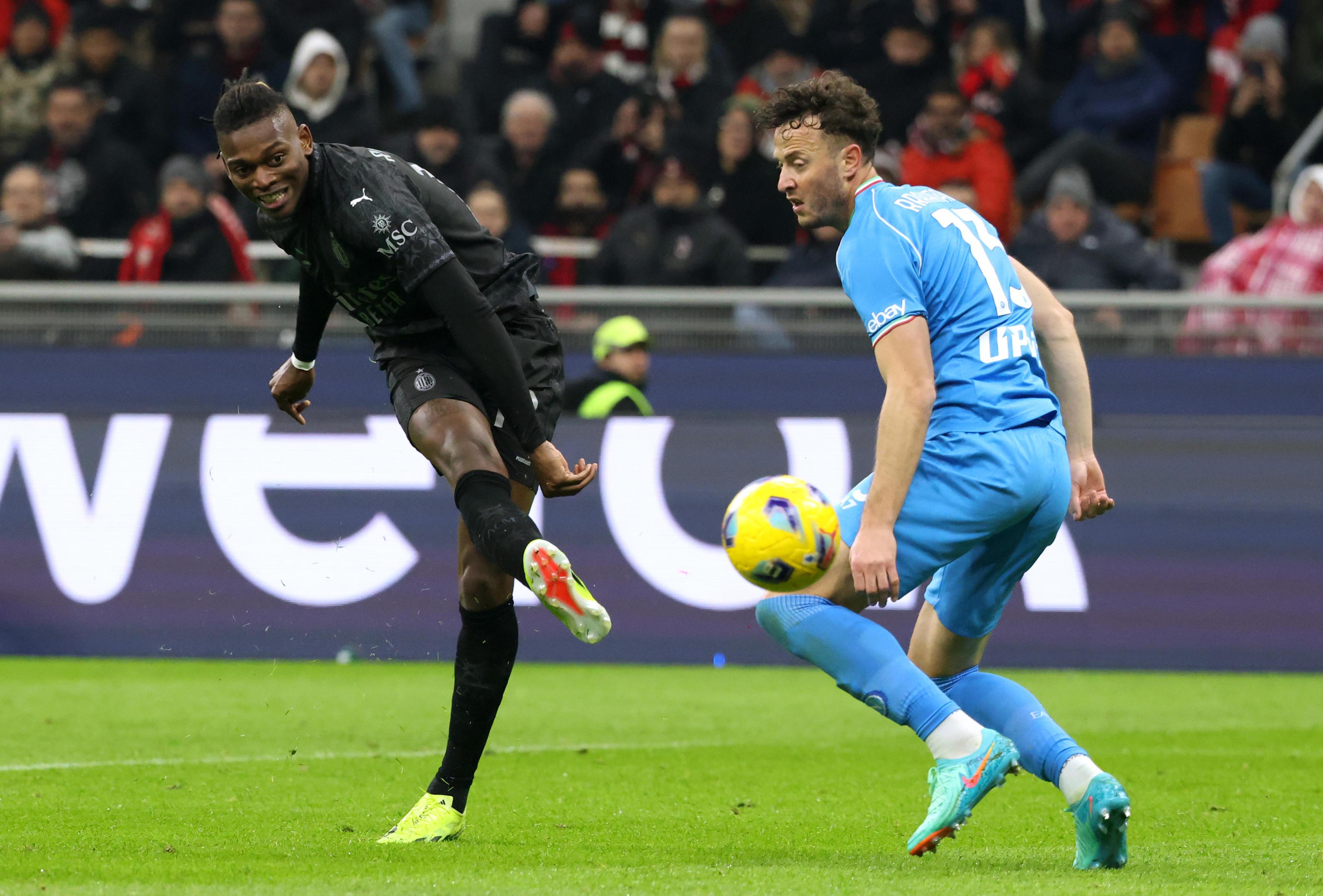 epa11146145 AC Milan's Rafael Leao (L) takes a shot on goal during the Italian Serie A soccer match between AC Milan and Napoli at Giuseppe Meazza stadium in Milan, Italy, 11 February 2024.  EPA-EFE/MATTEO BAZZI
