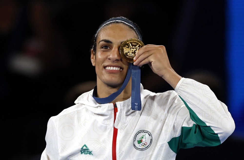 epa11541369 Gold medal winner Imane Khelif of Algeria poses on the podium of the Women's 66kg Final category of the Boxing competitions in the Paris 2024 Olympic Games, at Roland Garros in Paris, France, 09 August 2024.  EPA-EFE/MAST IRHAM