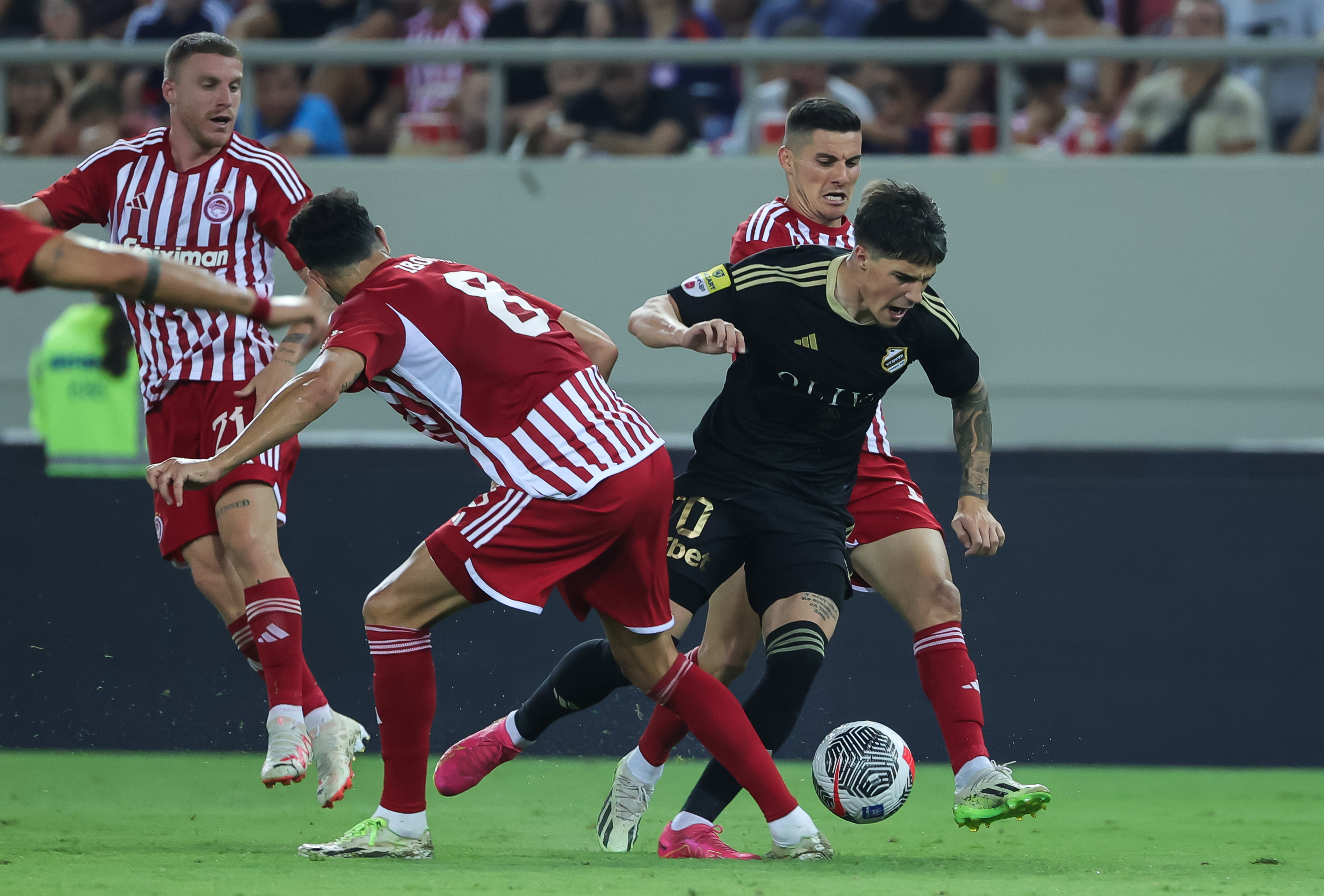 Aleksa Jankovic (C) Vicente Iborra (L) during the UEFA Europa League Qualifiers 2023/2024 match between Olympiacos and FK Cukaricki on August 24, 2023 in Athens, Greece. (Photo by Srdjan Stevanovic/Starsport.rs ©)