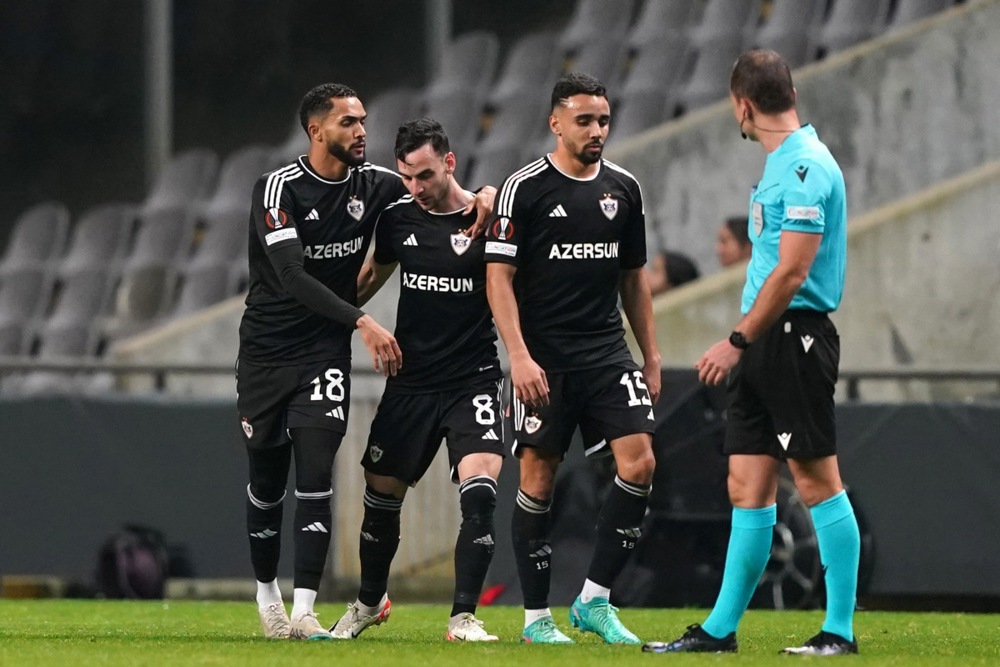 epa11156406 Qarabag player Marko Jankovic (C) celebrates after scoring a goal against Braga during their UEFA Europa League knockout round playoff first leg match, in Braga, north of Portugal, 15 February 2024.  EPA-EFE/HUGO DELGADO
