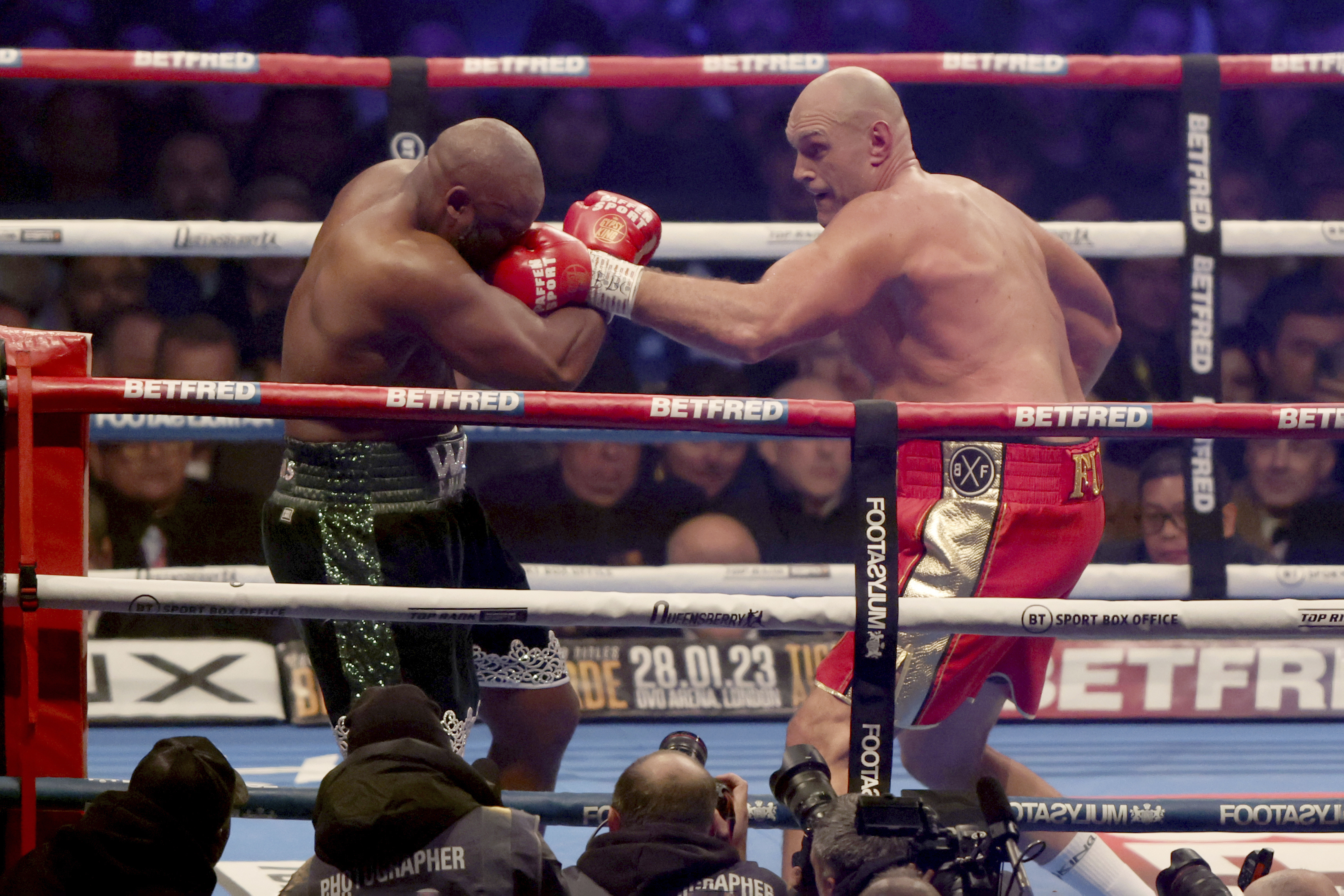 Tyson Fury, right, lands a punch during his WBC heavyweight championship boxing match against Derek Chisora at Tottenham Hotspur's White Hart Lane stadium London, Saturday Dec. 3, 2022.(AP Photo/Ian Walton)