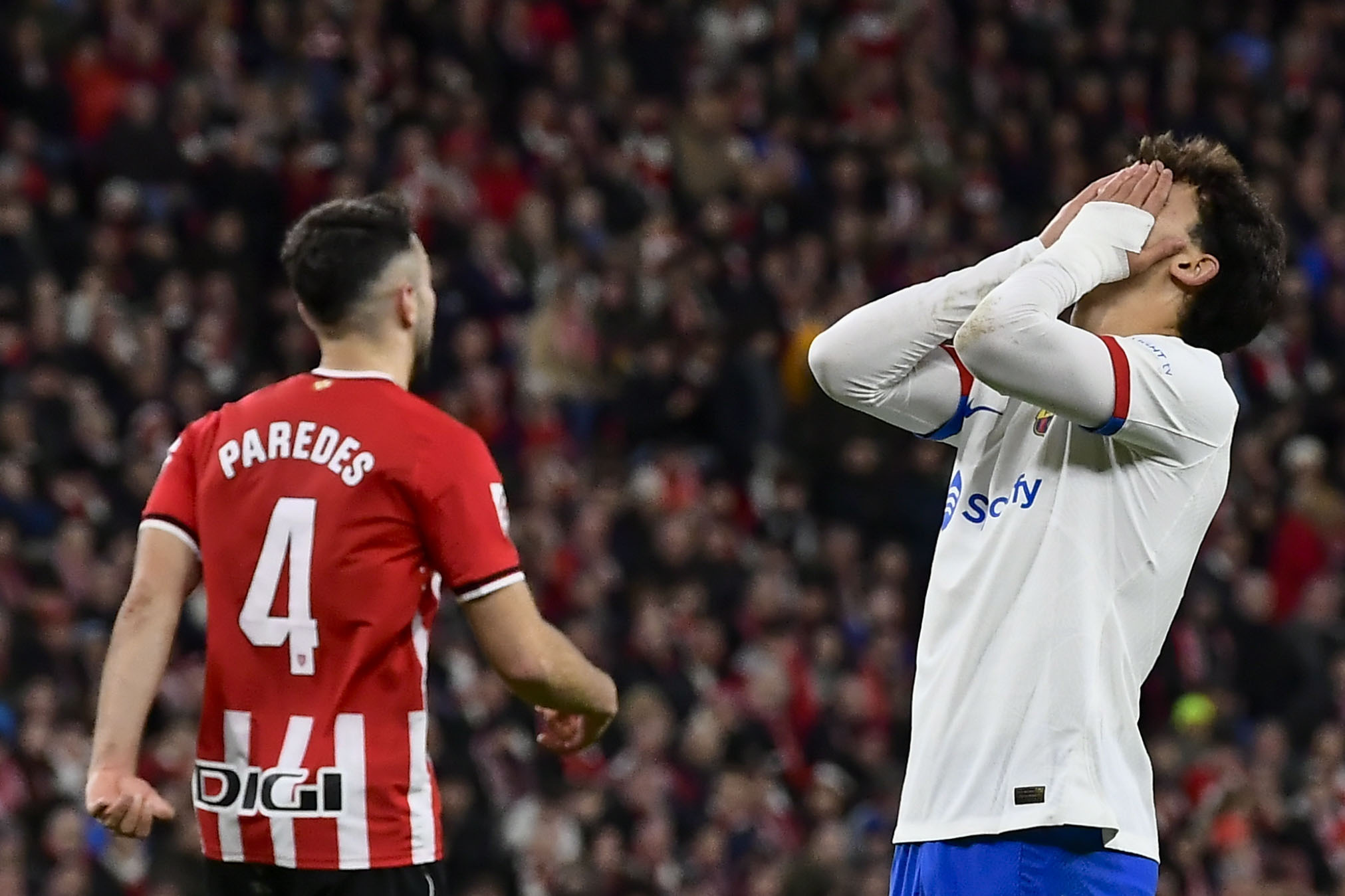 Barcelona's Joao Felix, right, reacts during a Spanish La Liga soccer match between Athletic Bilbao and Barcelona at the San Mames stadium in Bilbao, Spain, on Sunday, March 3, 2024. (AP Photo/Alvaro Barrientos)