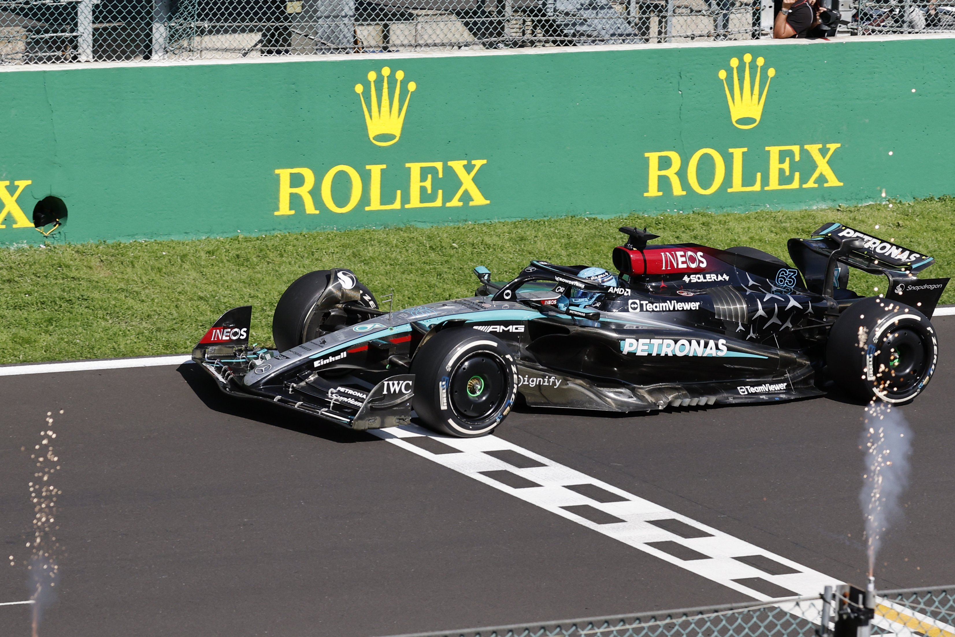 Mercedes driver George Russell of Britain crosses the finish line to win the Formula One Grand Prix at the Spa-Francorchamps racetrack in Spa, Belgium, Sunday, July 28, 2024. (AP Photo/Geert Vanden Wijngaert)