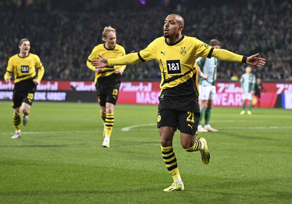 Dortmund's Donyell Malen celebrates his goal during the German Bundesliga soccer match between Borussia Dortmund and Werder Bremen at the Weserstadion stadium in Bremen, Germany, Saturday March 9, 2024. (Carmen Jaspersen/dpa via AP)