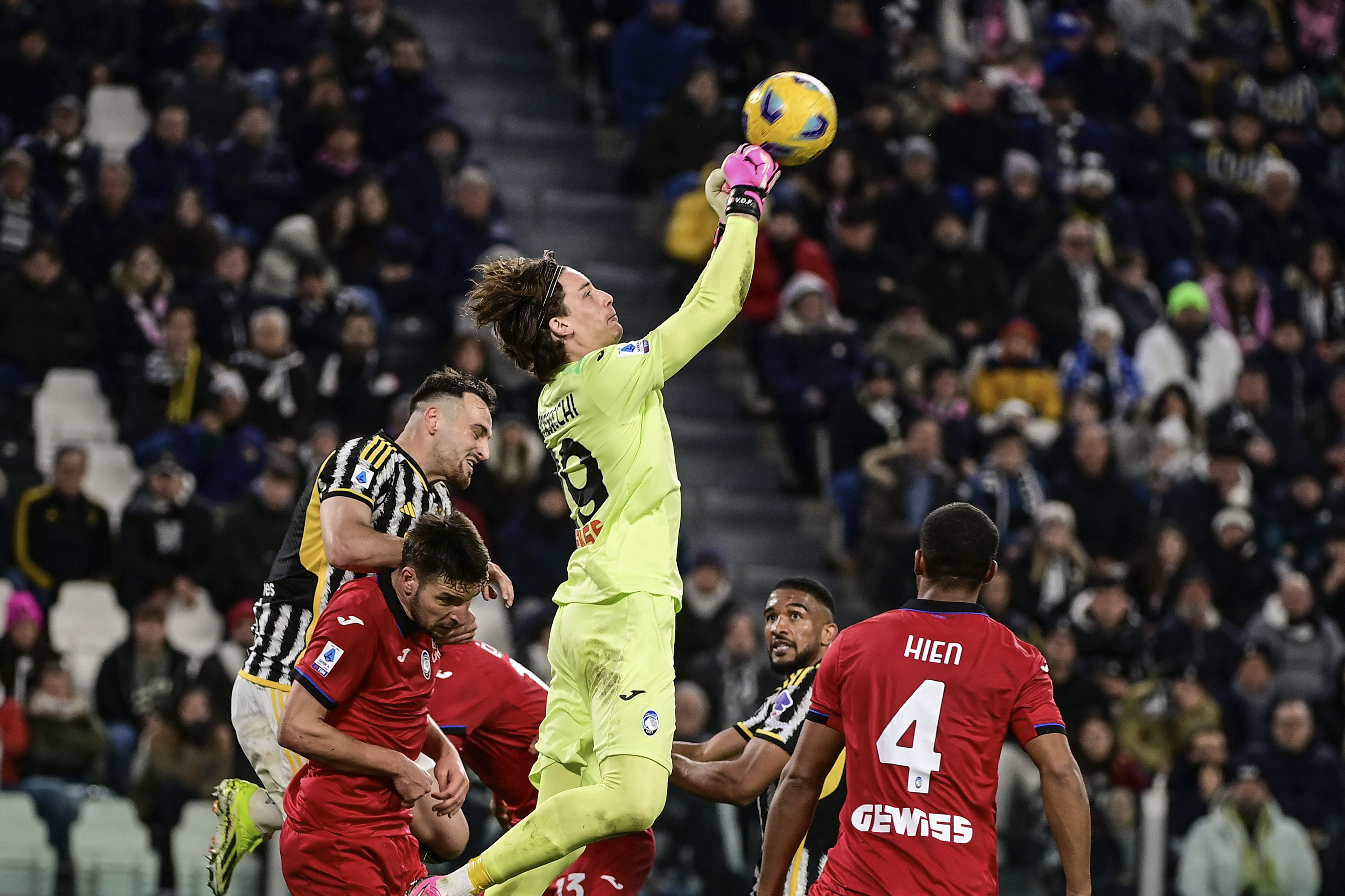 Atalanta's goalkeeper Marco Carnesecchi jumps for the ball, during the Italian Serie A soccer match between Juventus and Atalanta at the Allianz Stadium in Turin, Italy, Sunday, March 10, 2024. (Marco Alpozzi/LaPresse via AP)