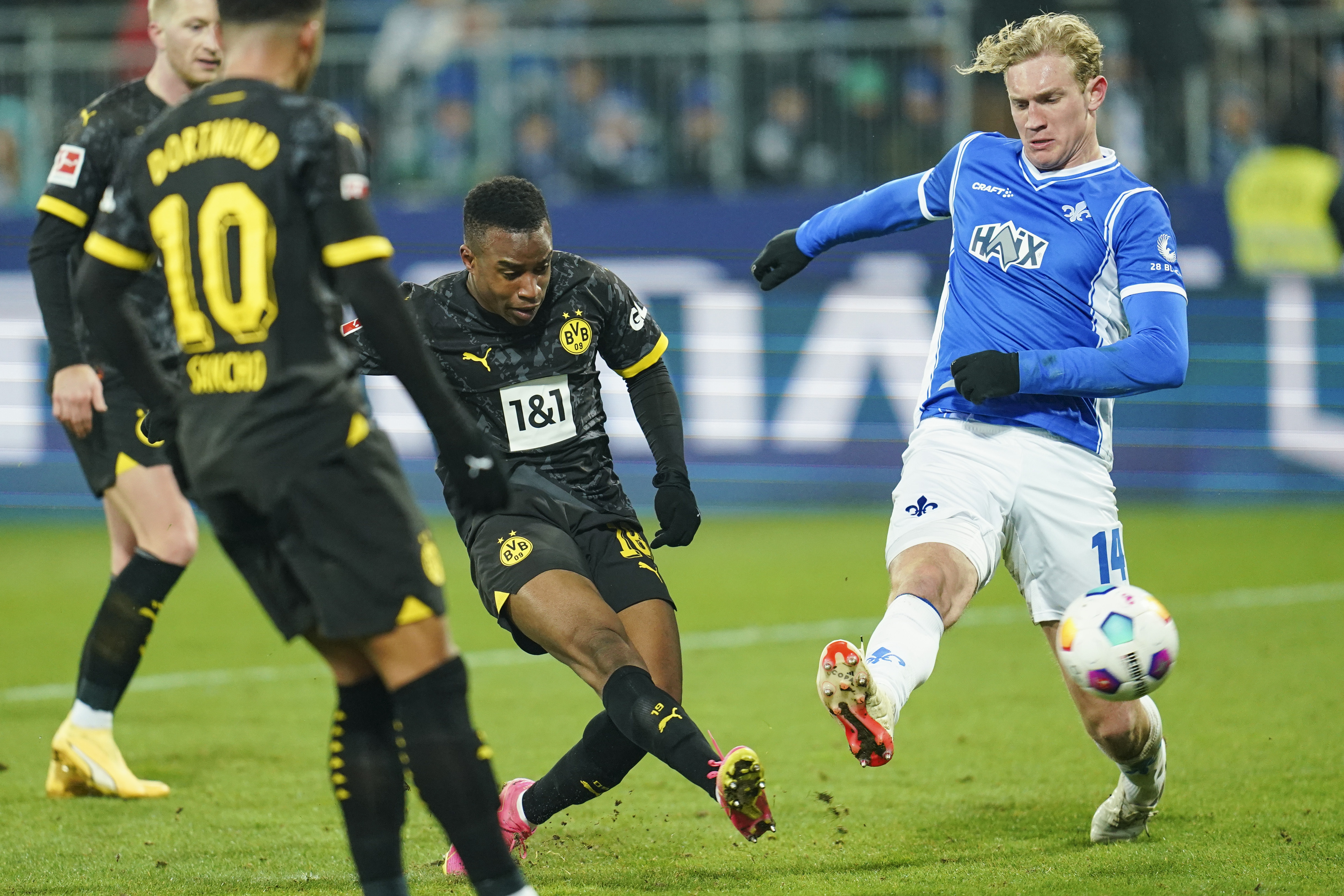 Dortmund's Youssoufa Moukoko scores their side's third goal during the Bundesliga soccer match between Borussia Dortmund and SV Darmstadt at Merck-Stadion am Böllenfalltor in Darmstadt, Germany, Saturday Jan. 13, 2024. (Uwe Anspach/dpa via AP)