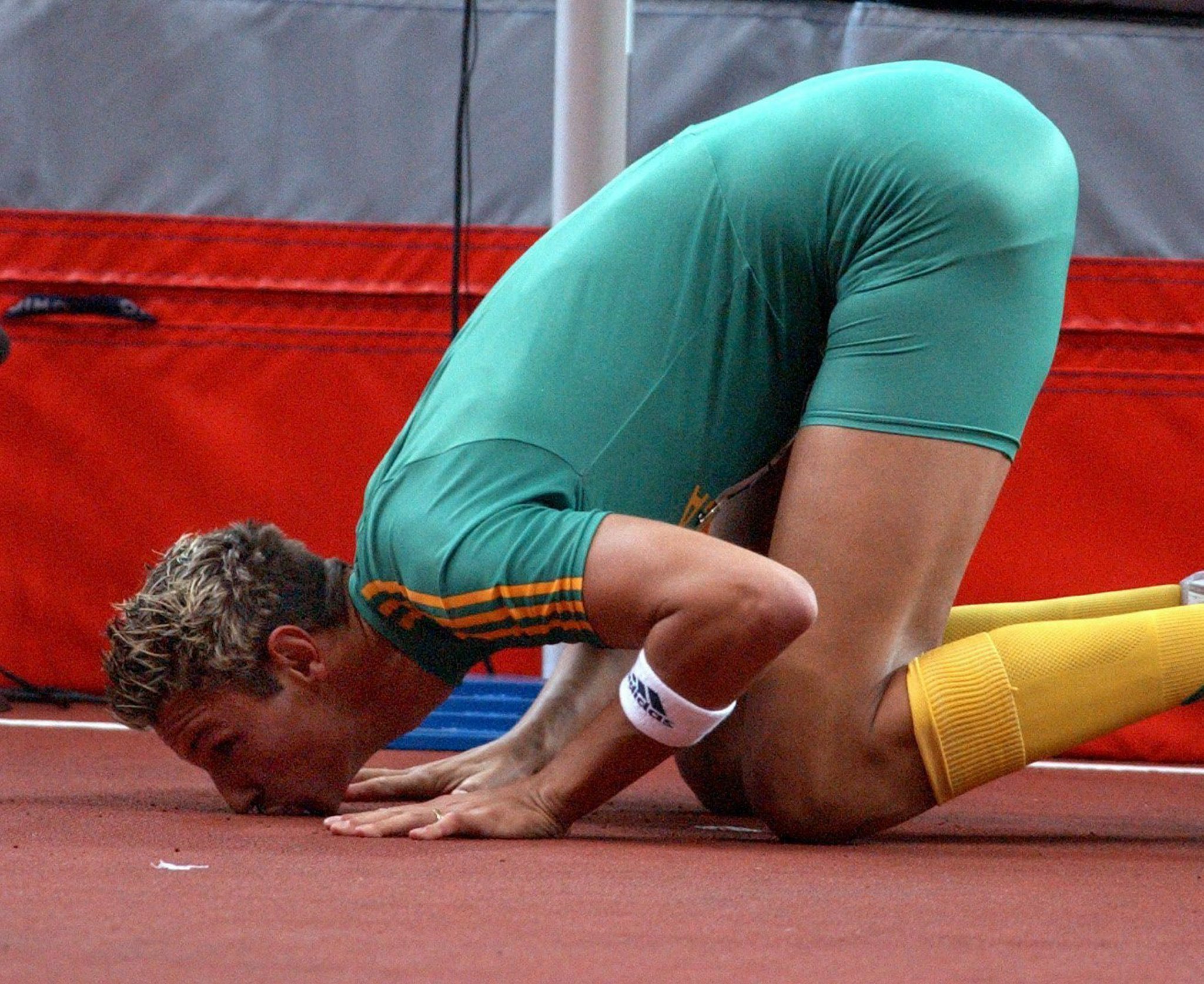 South African Jacques Freitag kisses the track after winning the men's high jump event at the 9th IAAF Athlectic World Championships at the Stade de France in Paris, Monday 25 August 2003.
EPA PHOTO DPA Arne Dedert
