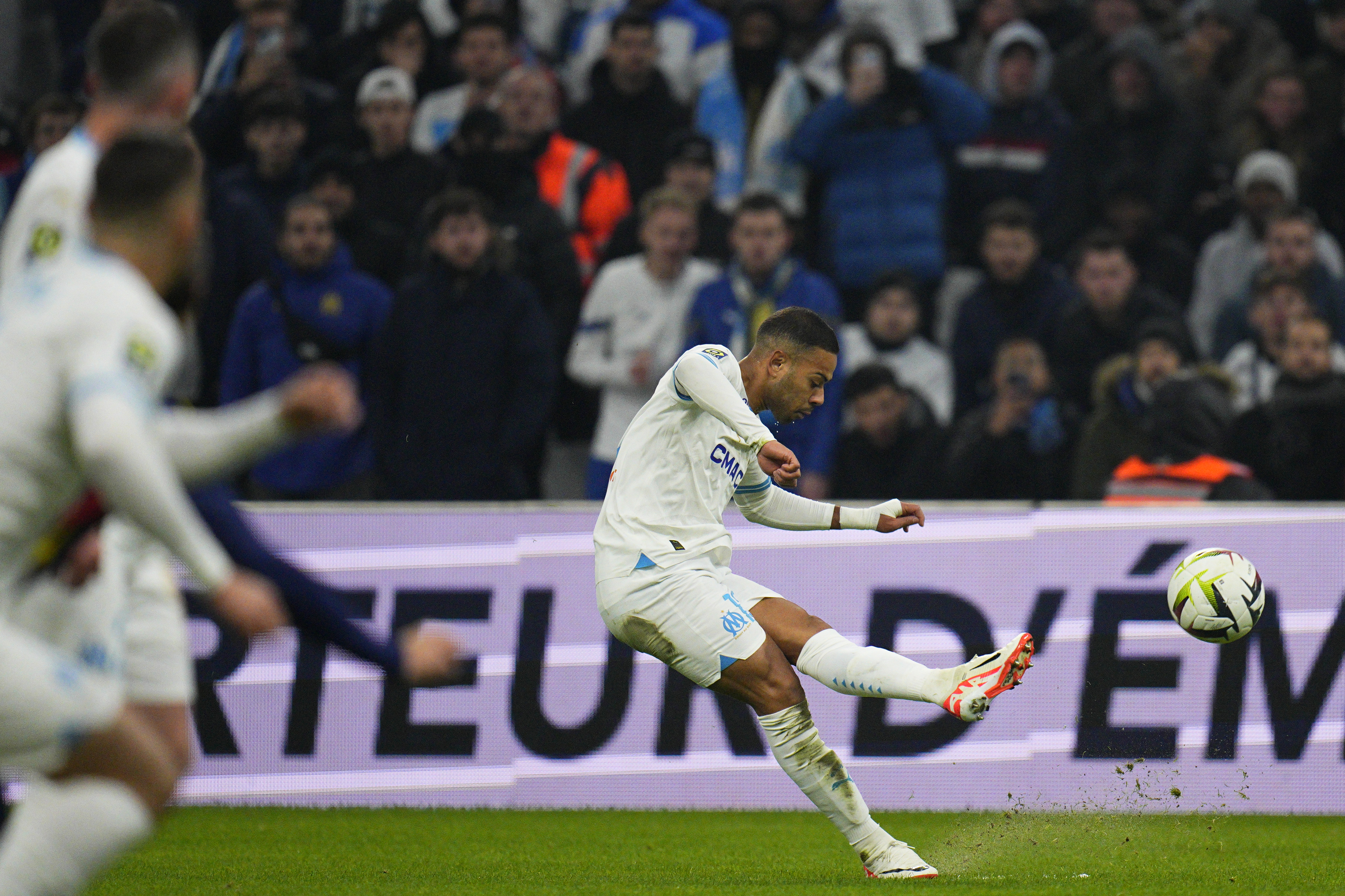Marseille's Renan Lodi shoots on target during the French League One soccer match between Olympique de Marseille and Lyon at the Velodrome Stadium in Marseille, France, Wednesday, Dec. 6, 2023. (AP Photo/Daniel Cole)