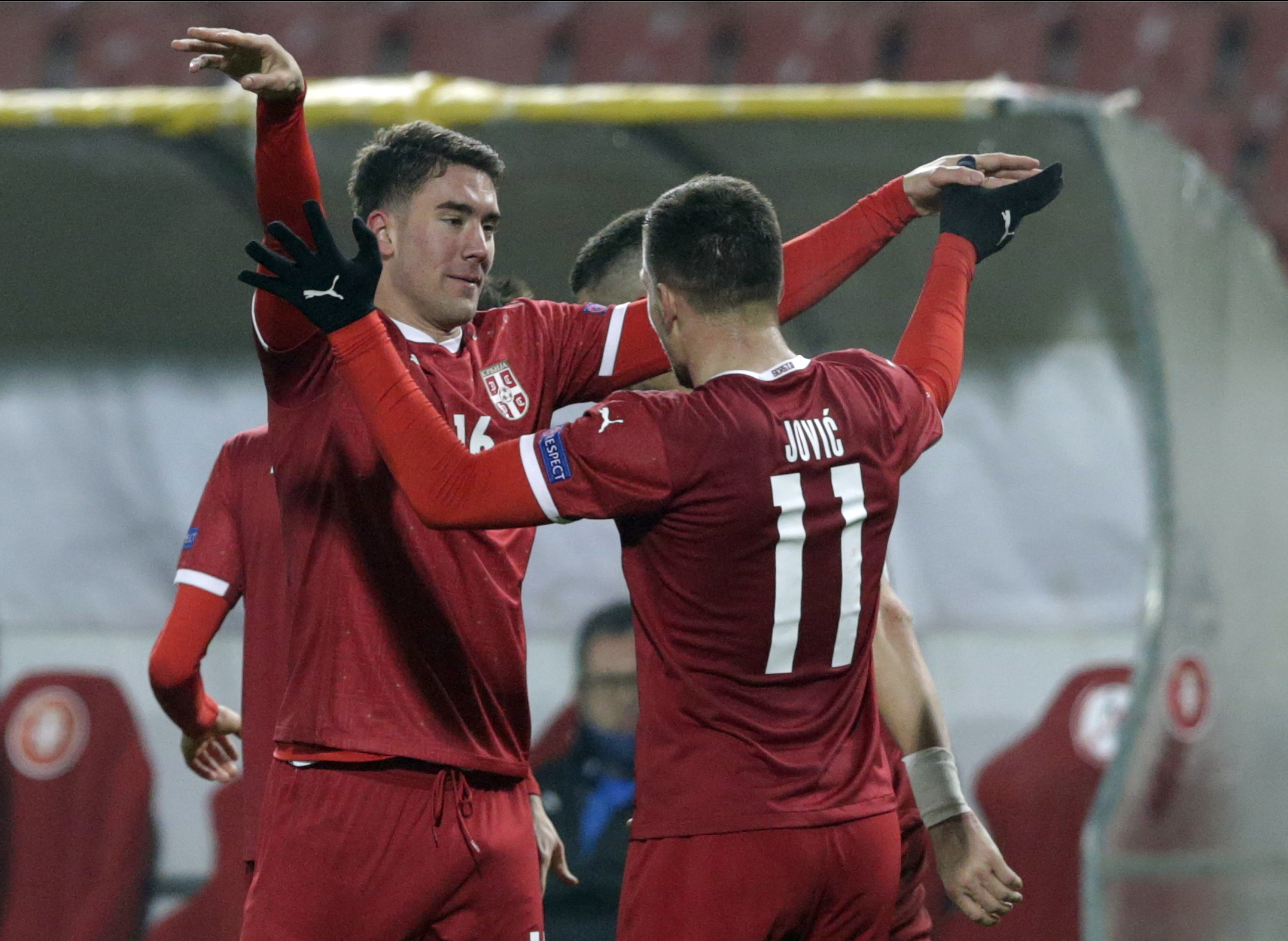 epa08828130 Serbia's Dusan Vlahovic (L) celebrates with Luka Jovic after scoring the 3-0 goal during the UEFA Nations League, League B, group 3 match, between Serbia and Russia in Belgrade, Serbia, 18 November 2020.  EPA-EFE/ANDREJ CUKIC