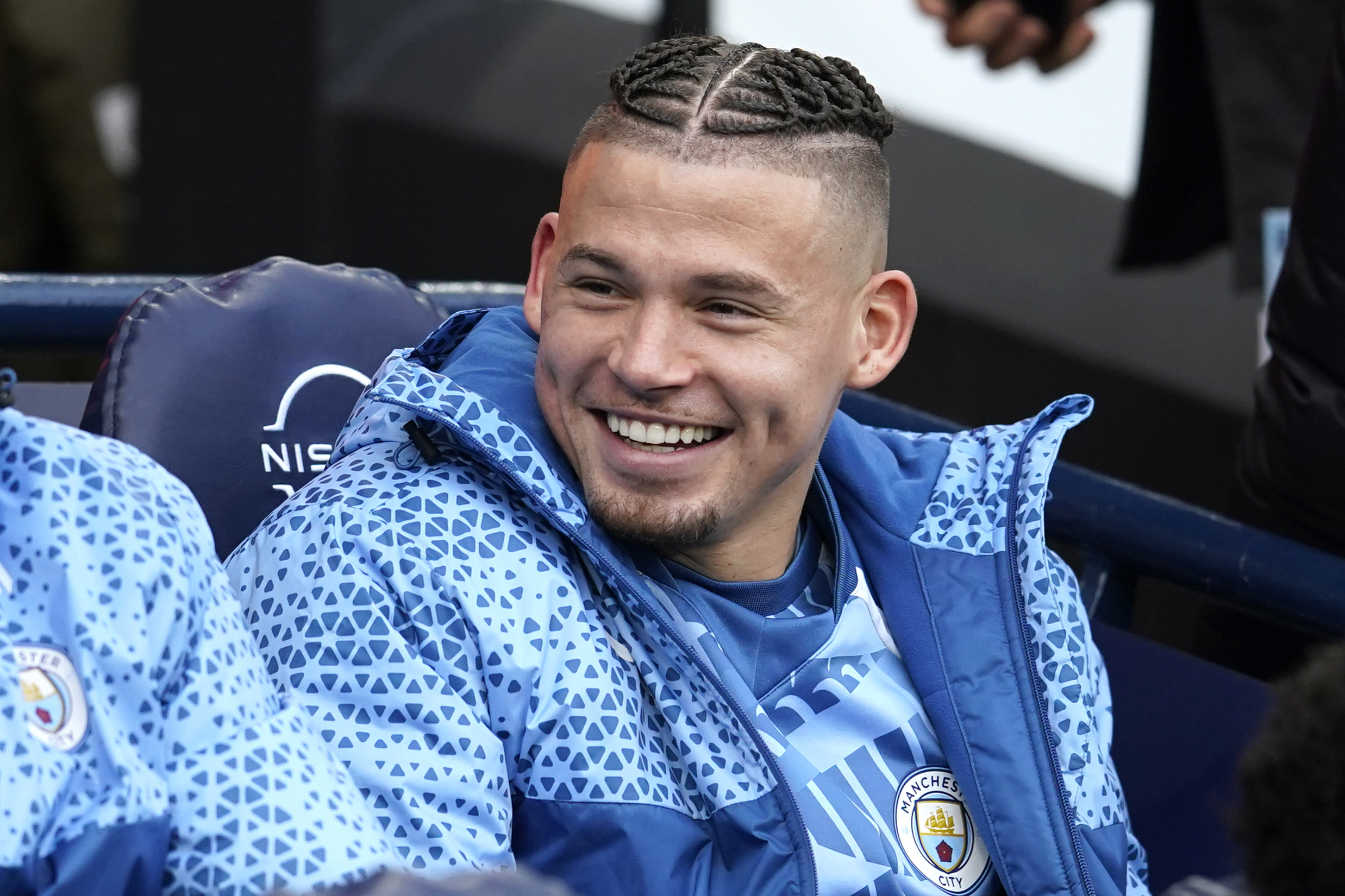Manchester City's Kalvin Phillips sits on the bench before the English Premier League soccer match between Manchester City and Crystal Palace at the Etihad Stadium in Manchester, England, Saturday, Dec. 16, 2023. (AP Photo/Dave Thompson)