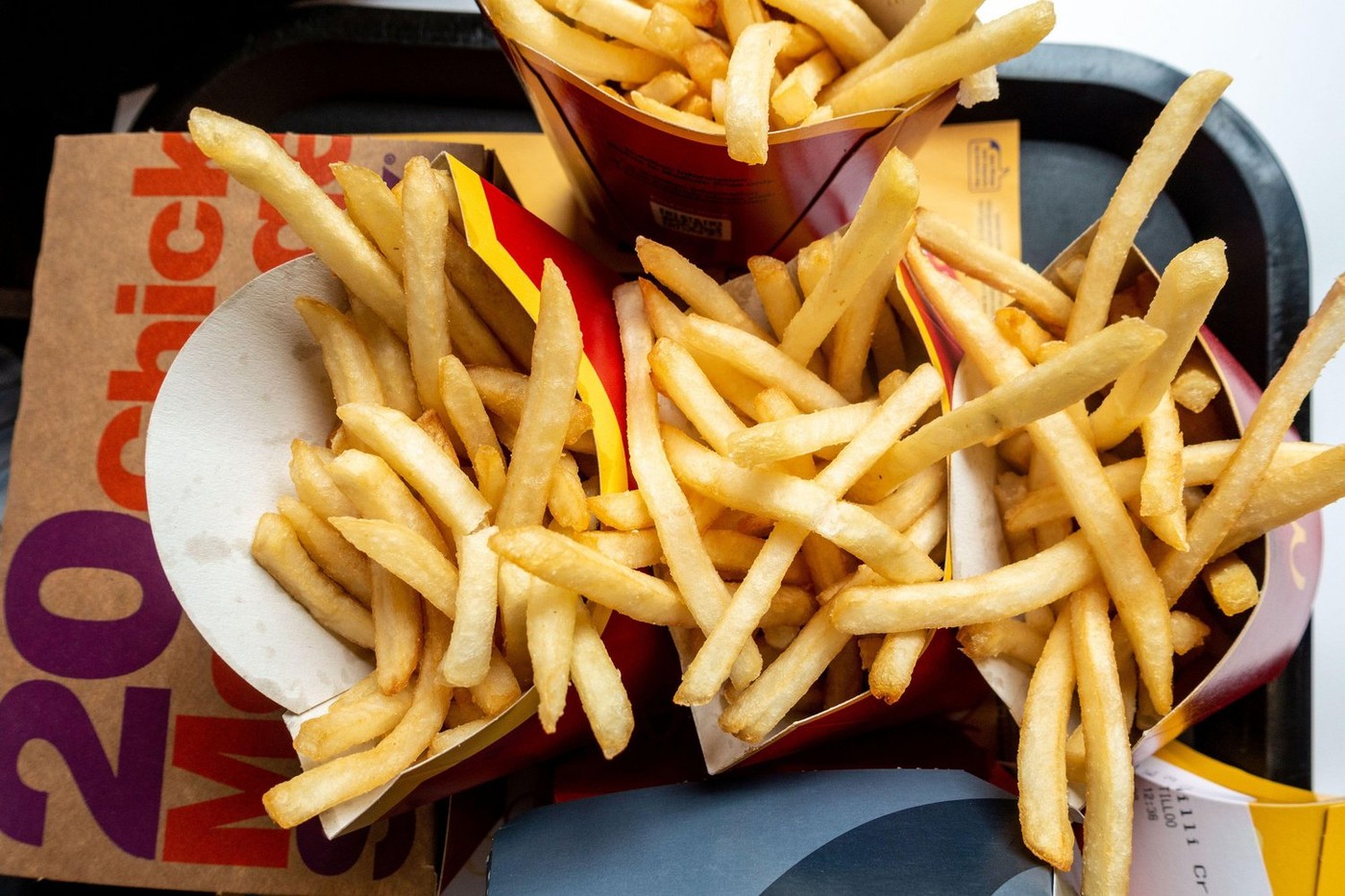 Looking down at McDonalds fries and chicken nuggets on a tray