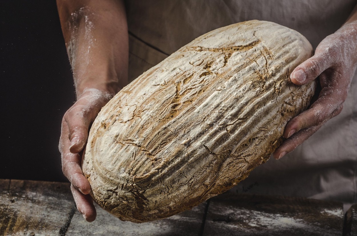 Homemade bread, place for your ad, female hands,Image: 321953744, License: Royalty-free, Restrictions: , Model Release: no, Credit line: Petr tepánek / Alamy / Alamy / Profimedia