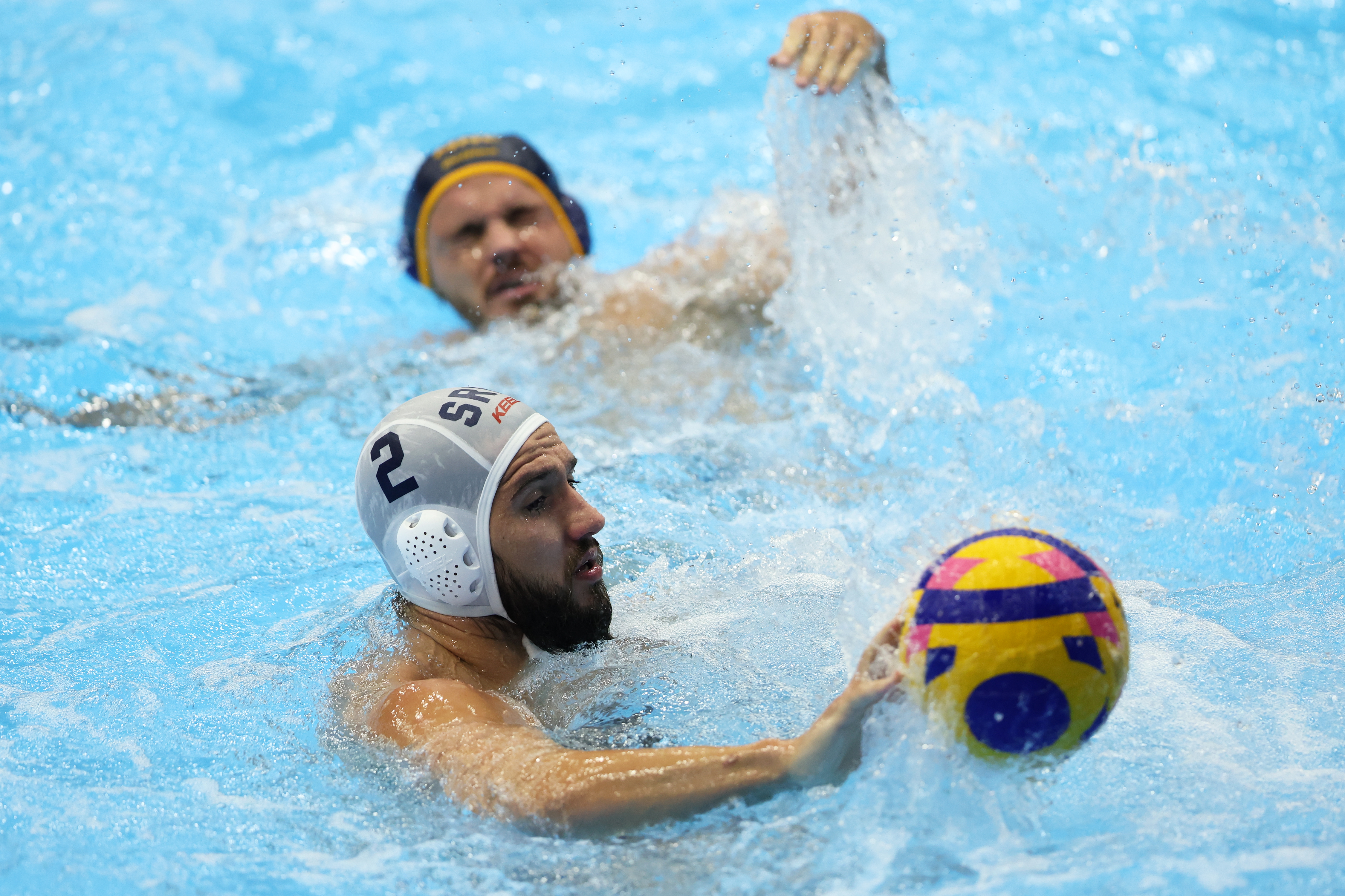 epa10759410 Marko Radulovic of Serbia in action in the Men's Water Polo preliminary round match between Serbia and Montenegro during the World Aquatics Championships 2023 in Fukuoka, Japan, 21 July 2023.  EPA-EFE/KIYOSHI OTA