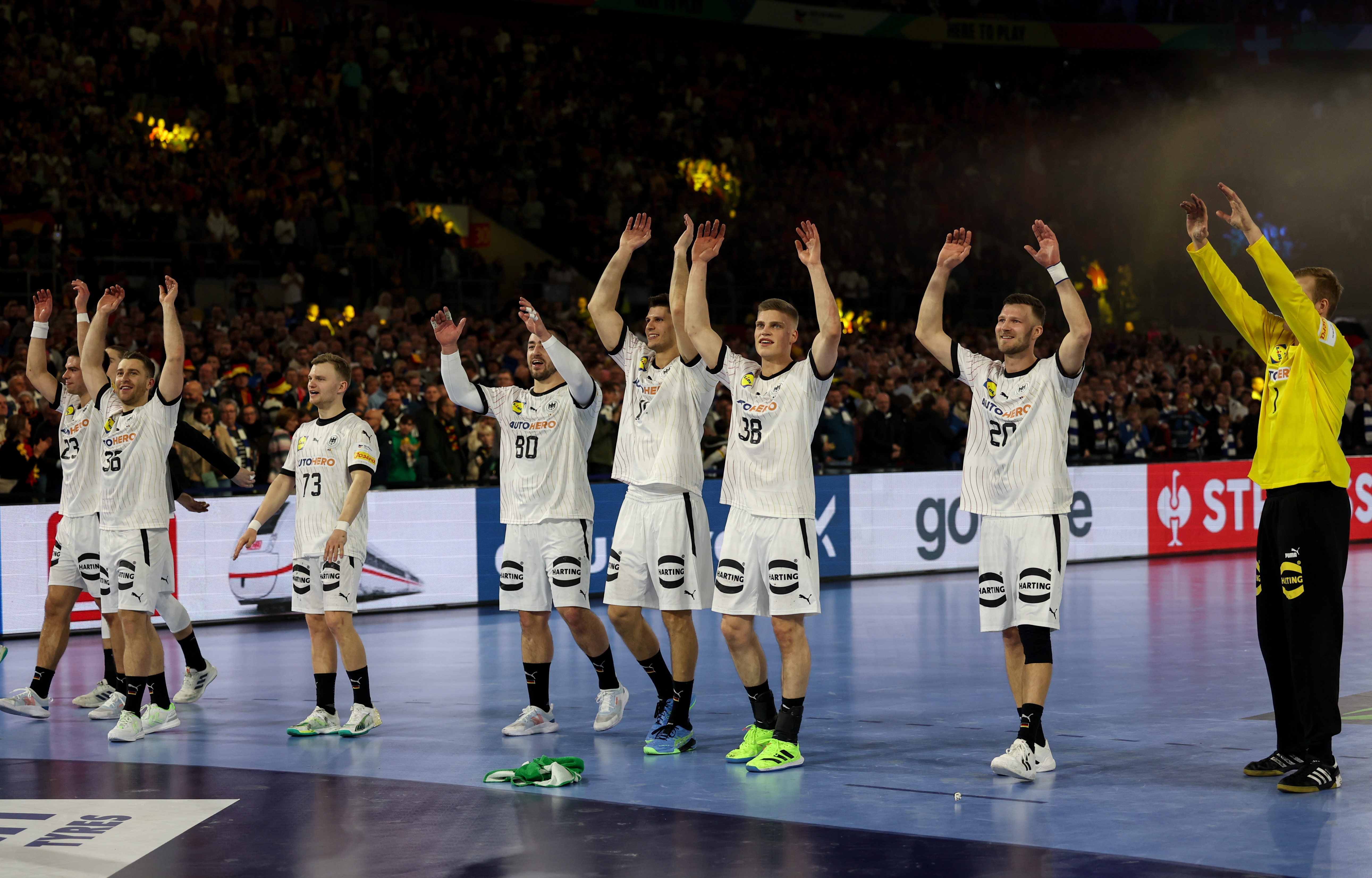 epa11068159 Germany's players celebrate after wining the Men's EHF EURO 2024 Handball Championship preliminary round group A match between Germany and Switzerland in Duesseldorf, Germany, 10 January 2024.  EPA-EFE/Christopher Neundorf