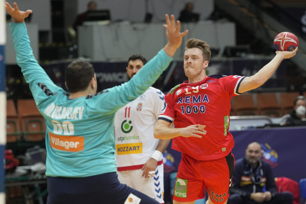 Norway's Kristian Bjornsen tries to score past Serbia's goalkeeper Dejan Milosavljev during the Main Round Group III, Handball World Championship match between Norway and Serbia in Katowice, Poland, Thursday, Jan. 19, 2023. (AP Photo/Piotr Hawalej)