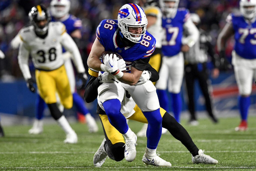 Buffalo Bills tight end Dalton Kincaid (86) is tackled by Pittsburgh Steelers cornerback Patrick Peterson (20) during the third quarter of an NFL wild-card playoff football game, Monday, Jan. 15, 2024, in Buffalo, N.Y. (AP Photo/Adrian Kraus)