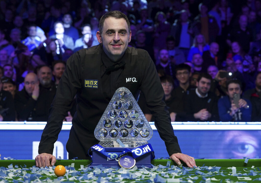 England's Ronnie O'Sullivan poses with the Paul Hunter trophy after victory over England's Ali Carter, not pictured, in the Masters final during day eight of the Masters at Alexandra Palace, in London, Sunday, Jan. 14, 2024. (Bradley Collyer/PA via AP)