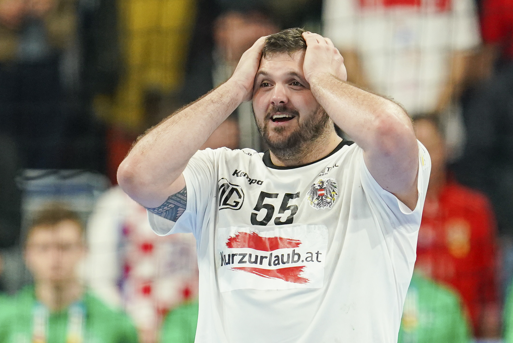 Austria's Tobias Wagner celebrates after the Handball European Championship preliminiary round Group B match between Spain and Austria in Mannheim, Germany, Tuesday, Jan. 16, 2024. (Uwe Anspach/dpa via AP)