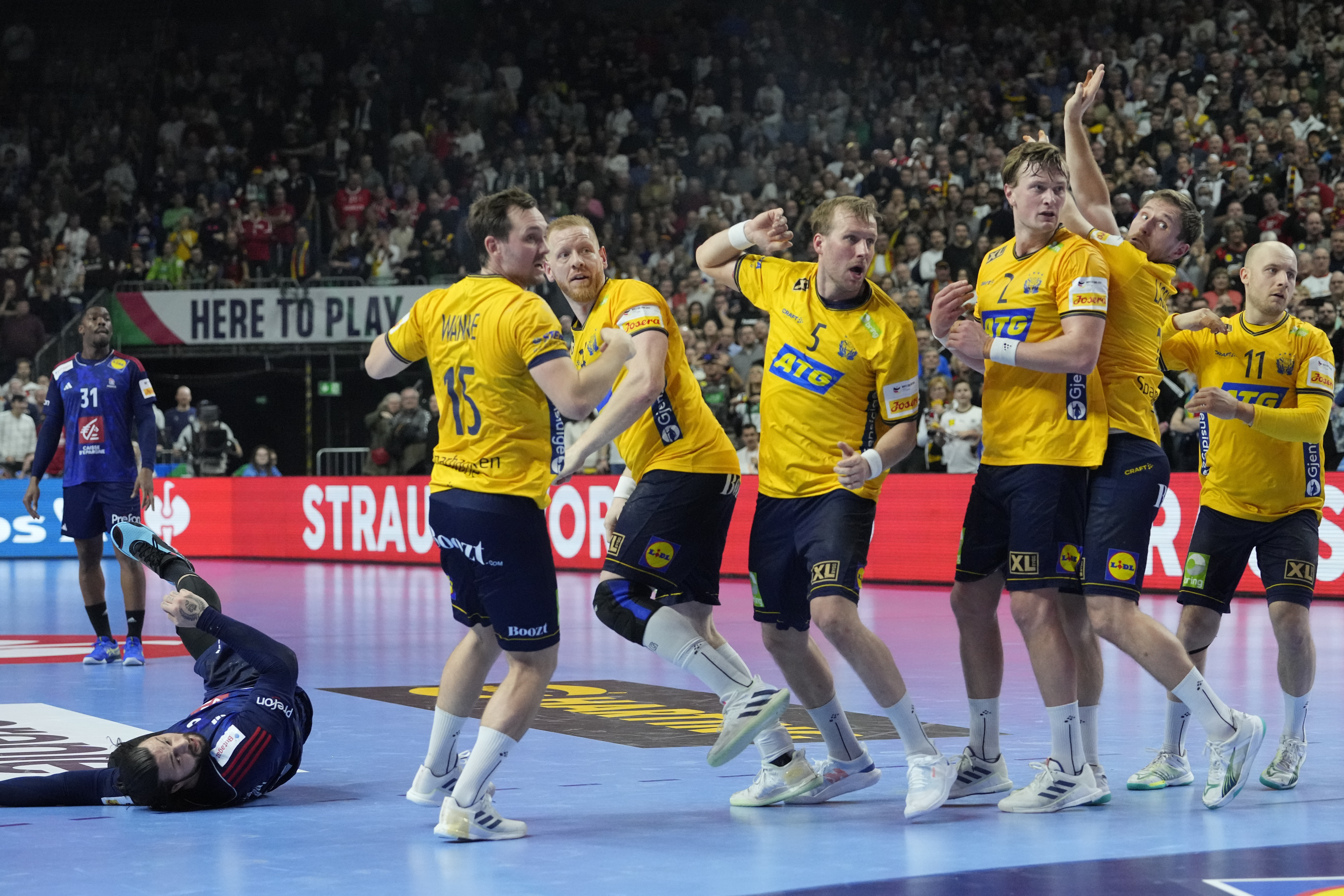 France's Elohim Prandi scores in the final second of the Handball European Championship semifinal match between France and Sweden in Cologne, Germany, Friday, Jan. 26, 2024. (AP Photo/Martin Meissner)