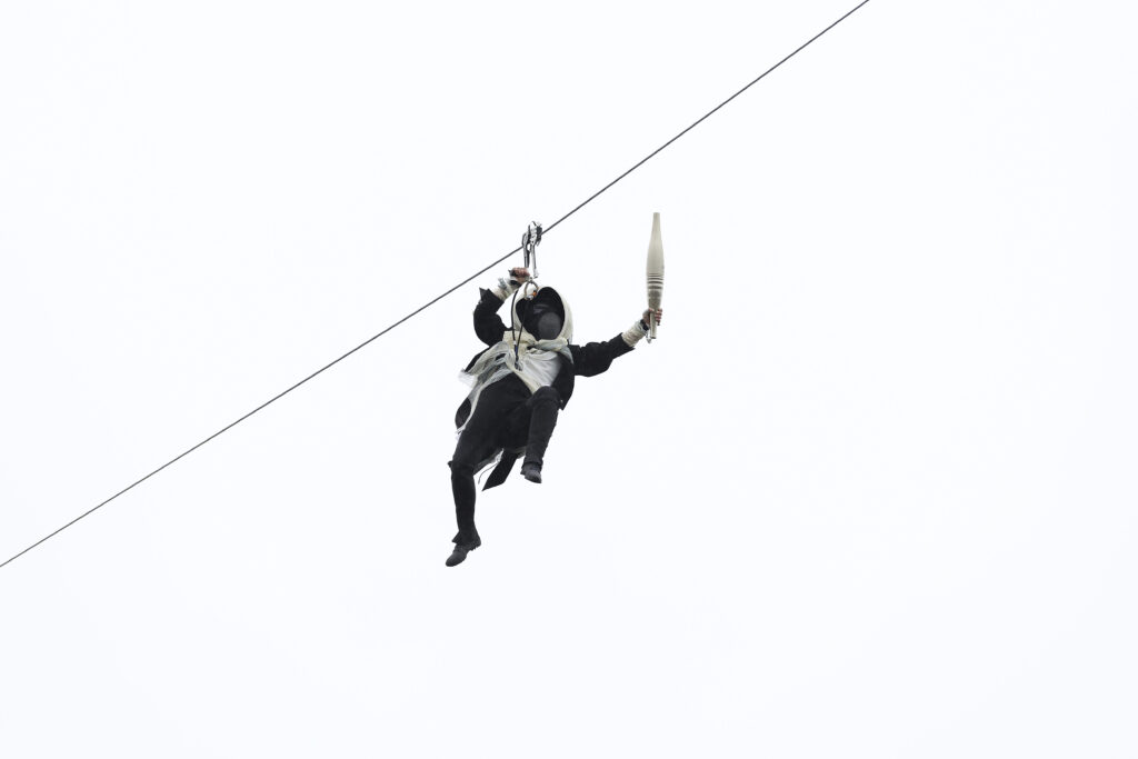 An actor performs during the opening ceremony for the 2024 Summer Olympics in Paris, France, Friday, July 26, 2024. (Zhao Dingzhe/Pool Photo via AP)