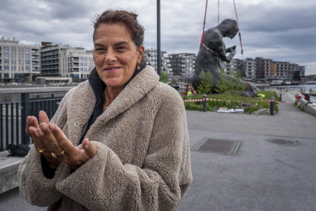 epa09992133 British artist Tracey Emin poses for photographs as she attends the installation of her sculpture 'The Mother' (in background) outside of the Munch Museum in Oslo, Norway, 02 June 2022.  EPA-EFE/Heiko Junge  NORWAY OUT