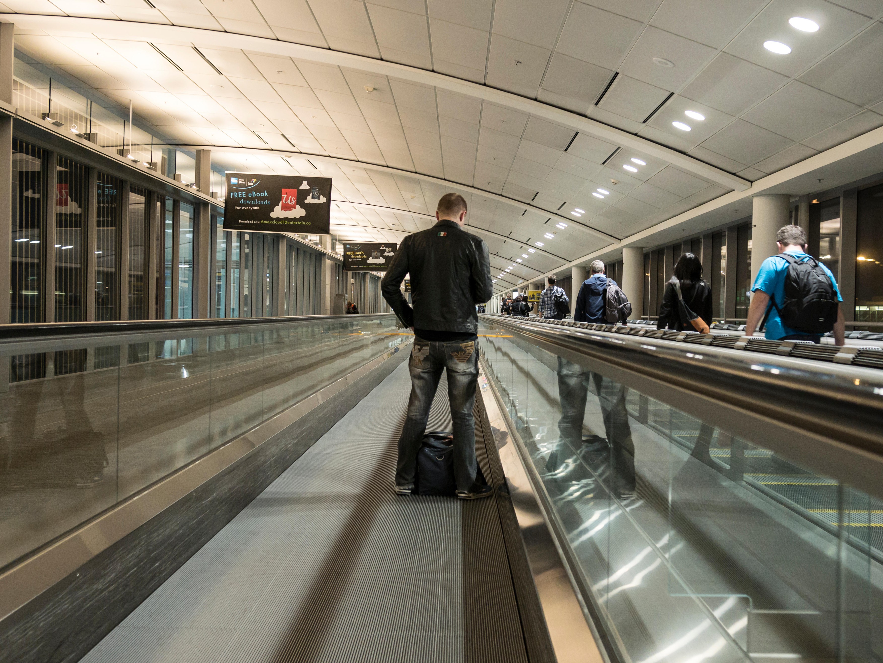 Passengers in Toronto international airport departure terminal.
