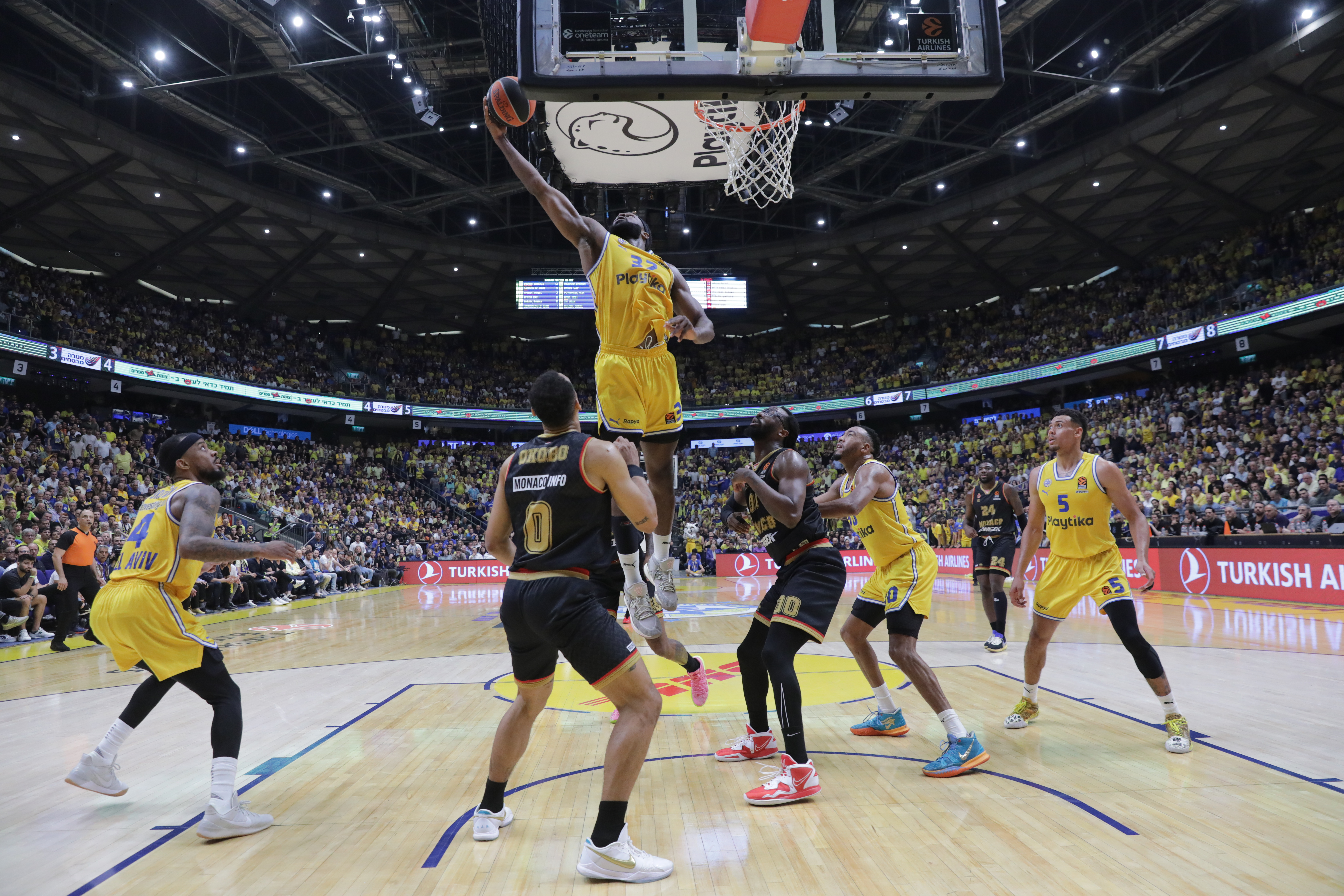epa10609066 Elie Okobo (L) of Monaco against Nedo Losh(C) of Maccabi Tel Aviv during the Euroleague basketball play-off match between Maccabi Tel Aviv and AS Monaco, in Tel Aviv, Israel, 04 May 2023.  EPA-EFE/ABIR SULTAN