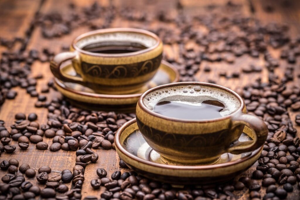 Two cups of coffee on wooden table,Image: 269568203, License: Royalty-free, Restrictions: , Model Release: no, Credit line: Cseh Ioan / Alamy / Alamy / Profimedia