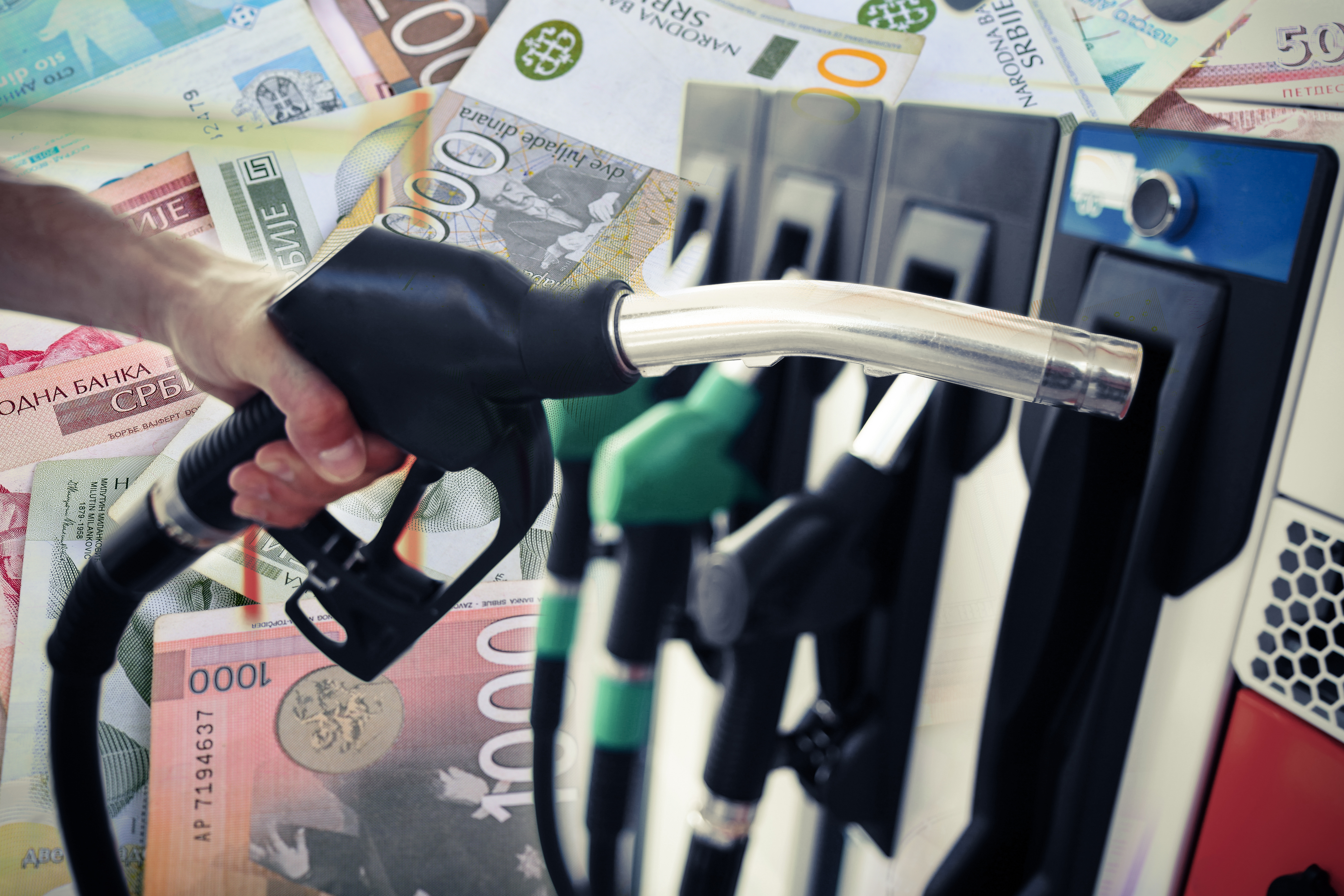 Detail,Of,A,Hand,Holding,A,Fuel,Pump,At,A