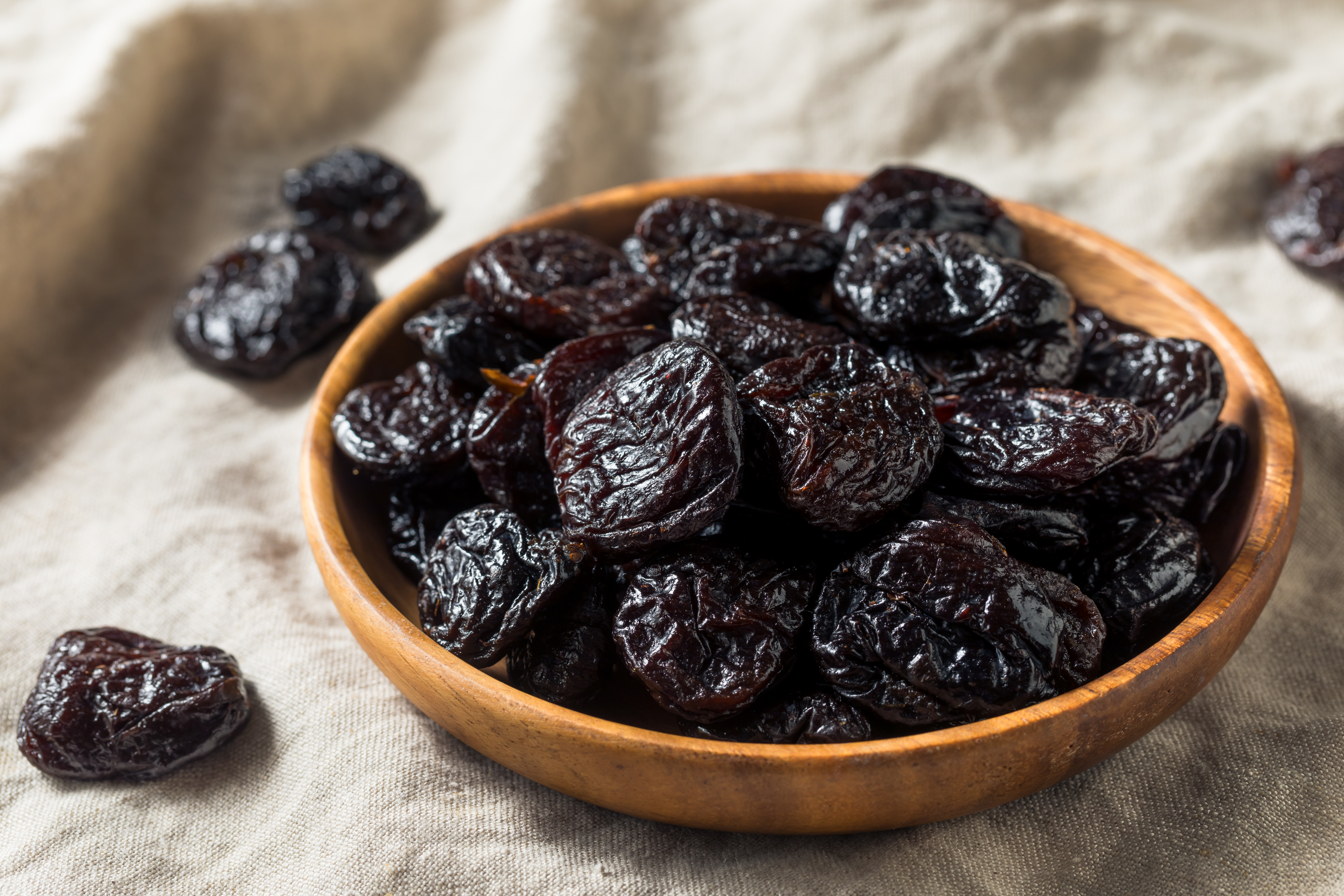 Raw,Organic,Dry,Prunes,In,A,Bowl
