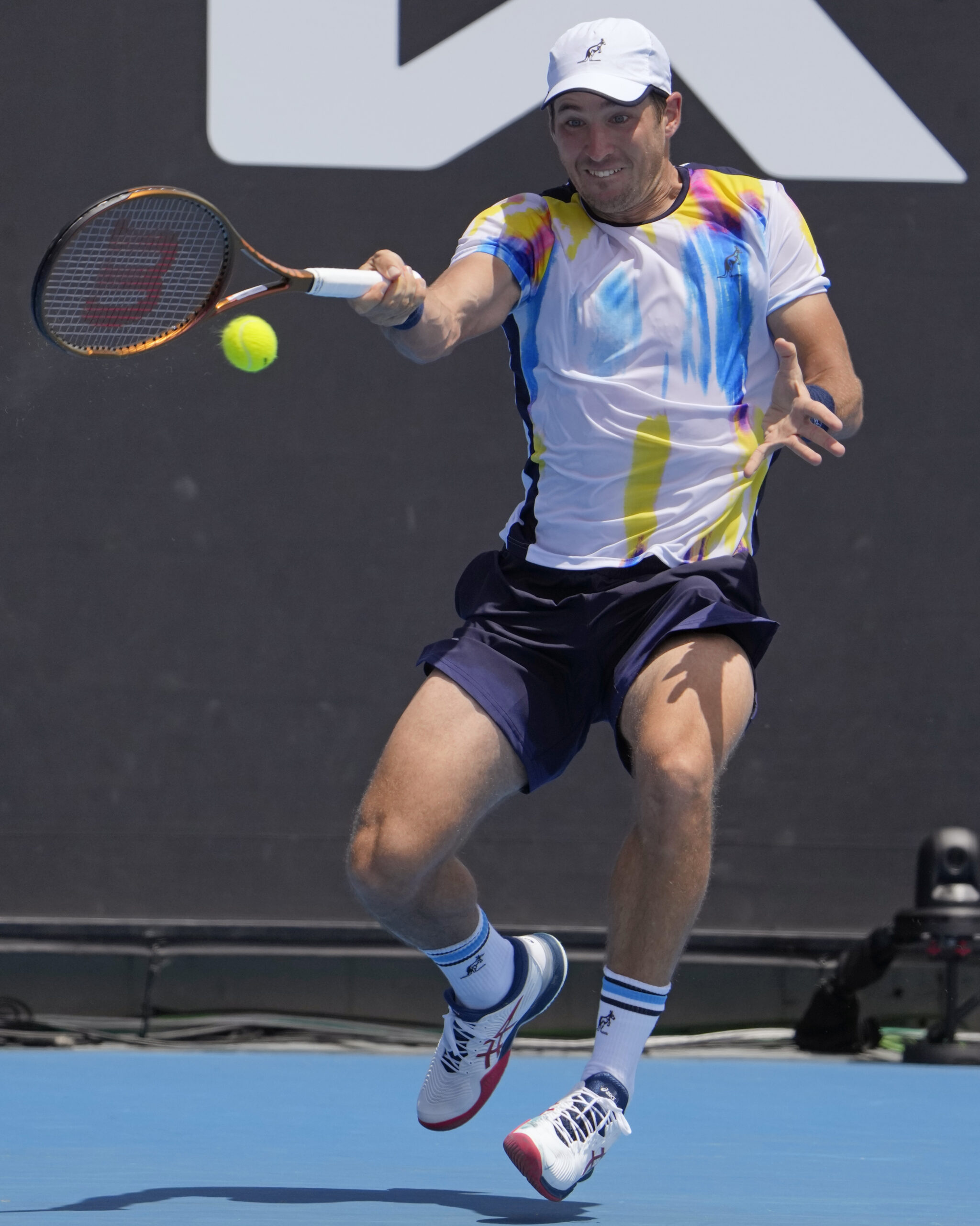 Dusan Lajovic of Serbia plays a forehand return to Denis Shapovalov of Canada during their first round match at the Australian Open tennis championship in Melbourne, Australia, Monday, Jan. 16, 2023. (AP Photo/Ng Han Guan)