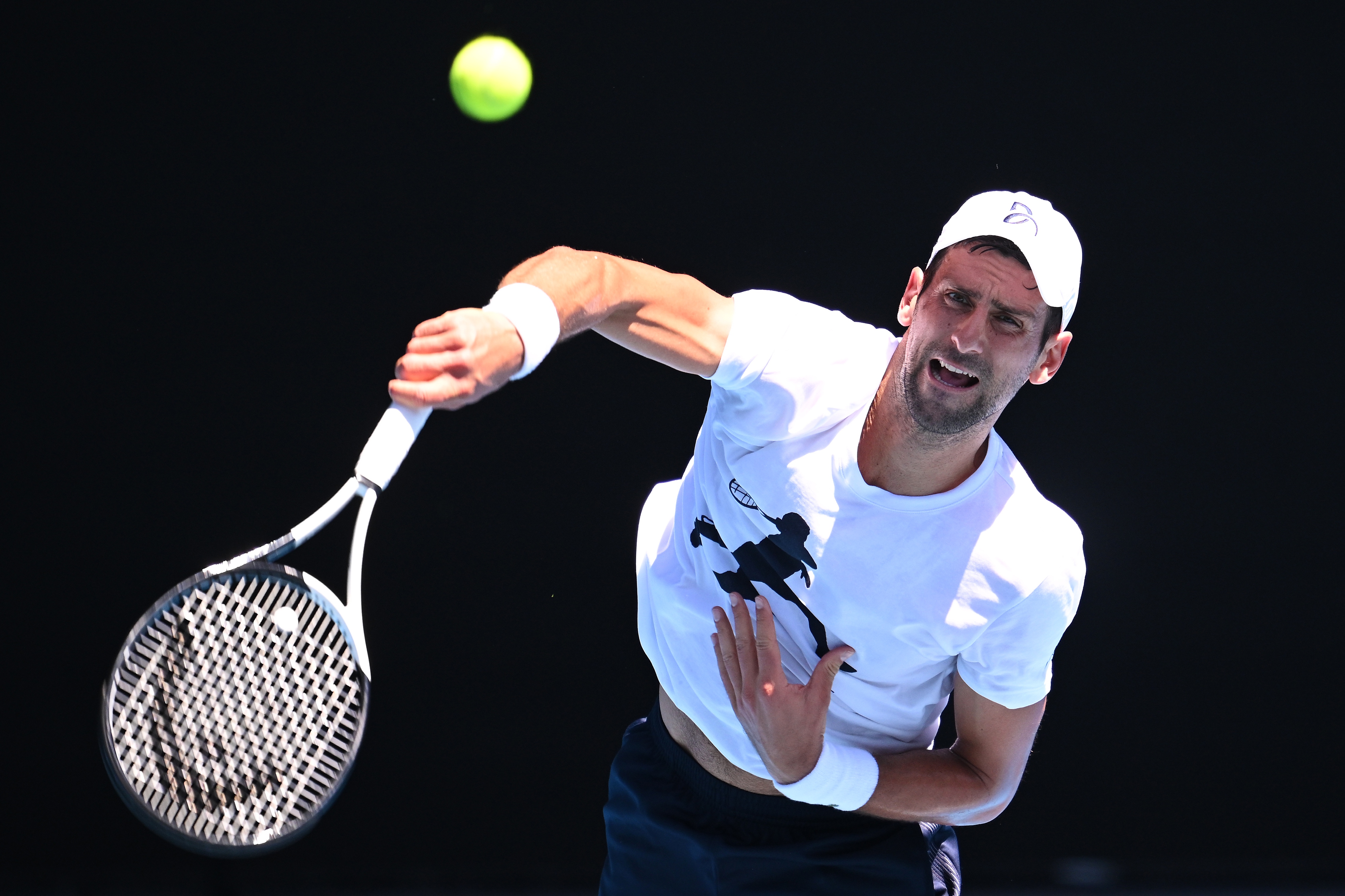 epa10399343 Novak Djokovic of Serbia in action against Daniil Medvedev of Russia during an Australian Open practice match at Melbourne Park in Melbourne, Australia, 11 January 2023.  EPA-EFE/JAMES ROSS AUSTRALIA AND NEW ZEALAND OUT