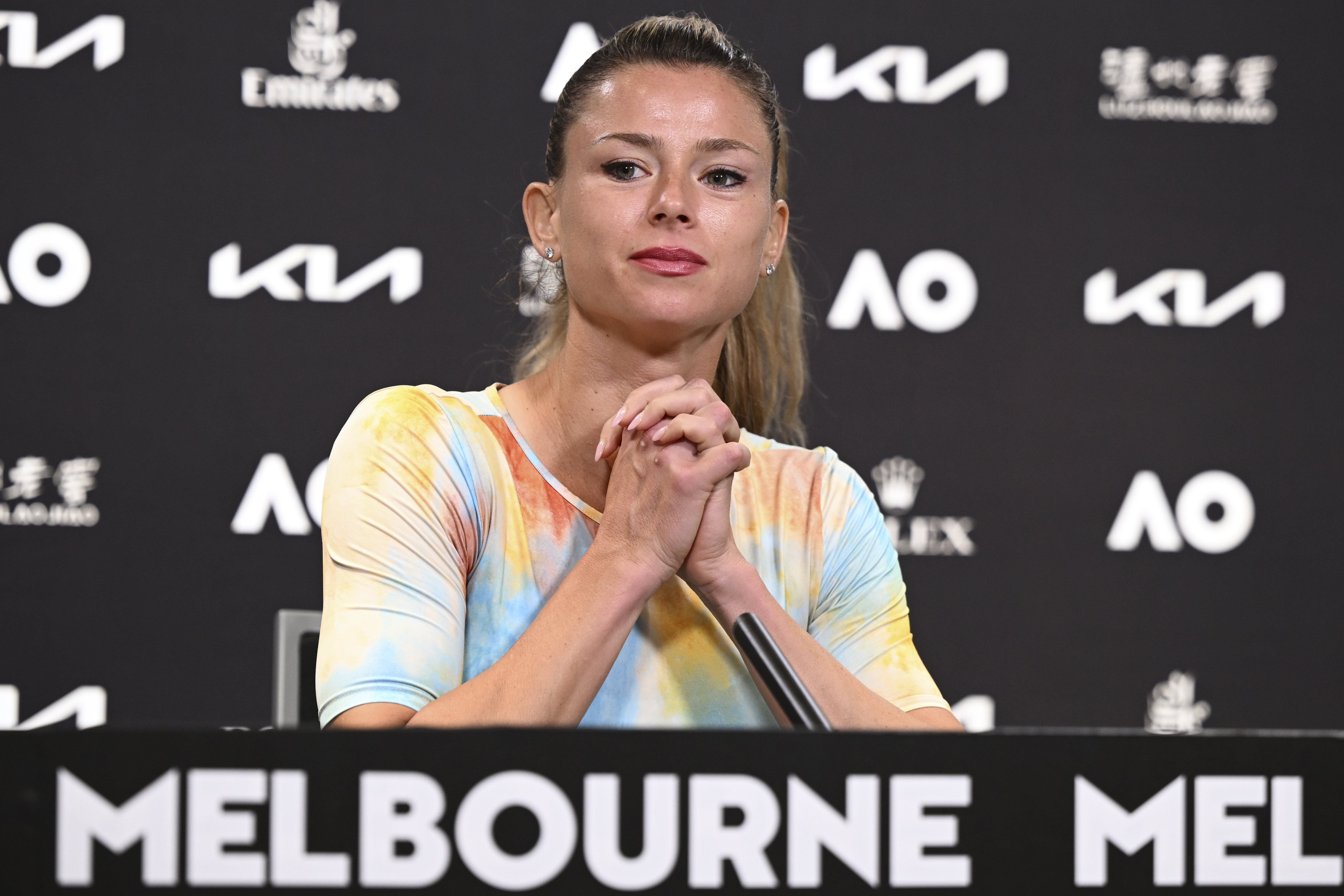 Italy's Camila Giorgi reacts during a player press conference at the 2023 Australian Open tennis championship in Melbourne Australia, Tuesday, Jan. 17, 2023. (Vince Caligiuri/Tennis Australia via AP)