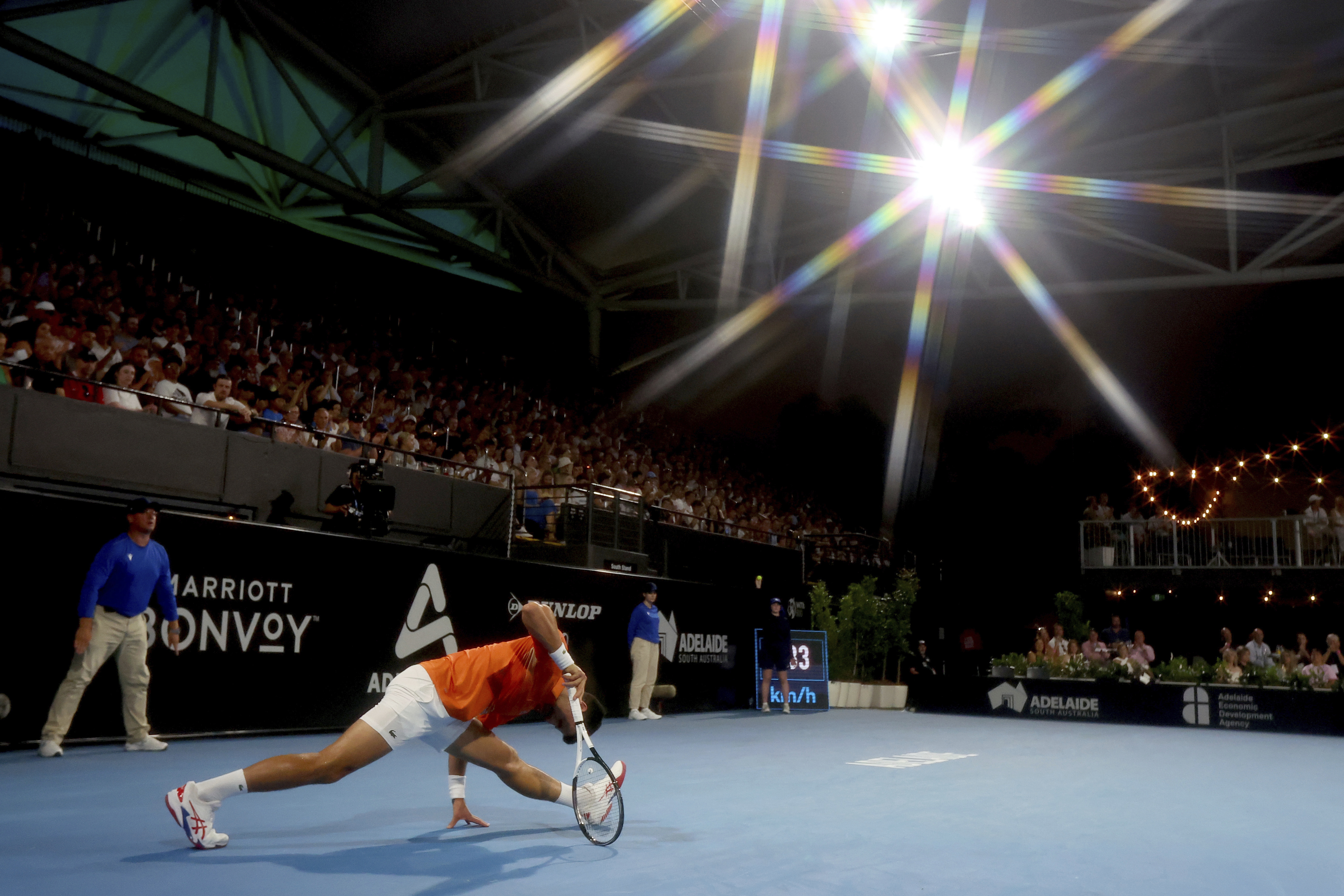 Serbia's Novak Djokovic stretches during his semifinal match against Russia's Daniil Medvedev at the Adelaide International Tennis tournament in Adelaide, Australia, Saturday, Jan. 7, 2023. (AP Photo/Kelly Barnes)