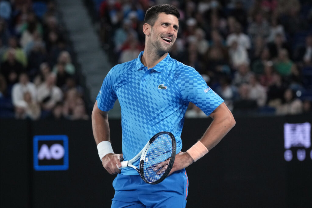 Novak Djokovic of Serbia reacts during his second round match against Enzo Couacaud of France at the Australian Open tennis championship in Melbourne, Australia, Thursday, Jan. 19, 2023. (AP Photo/Dita Alangkara)