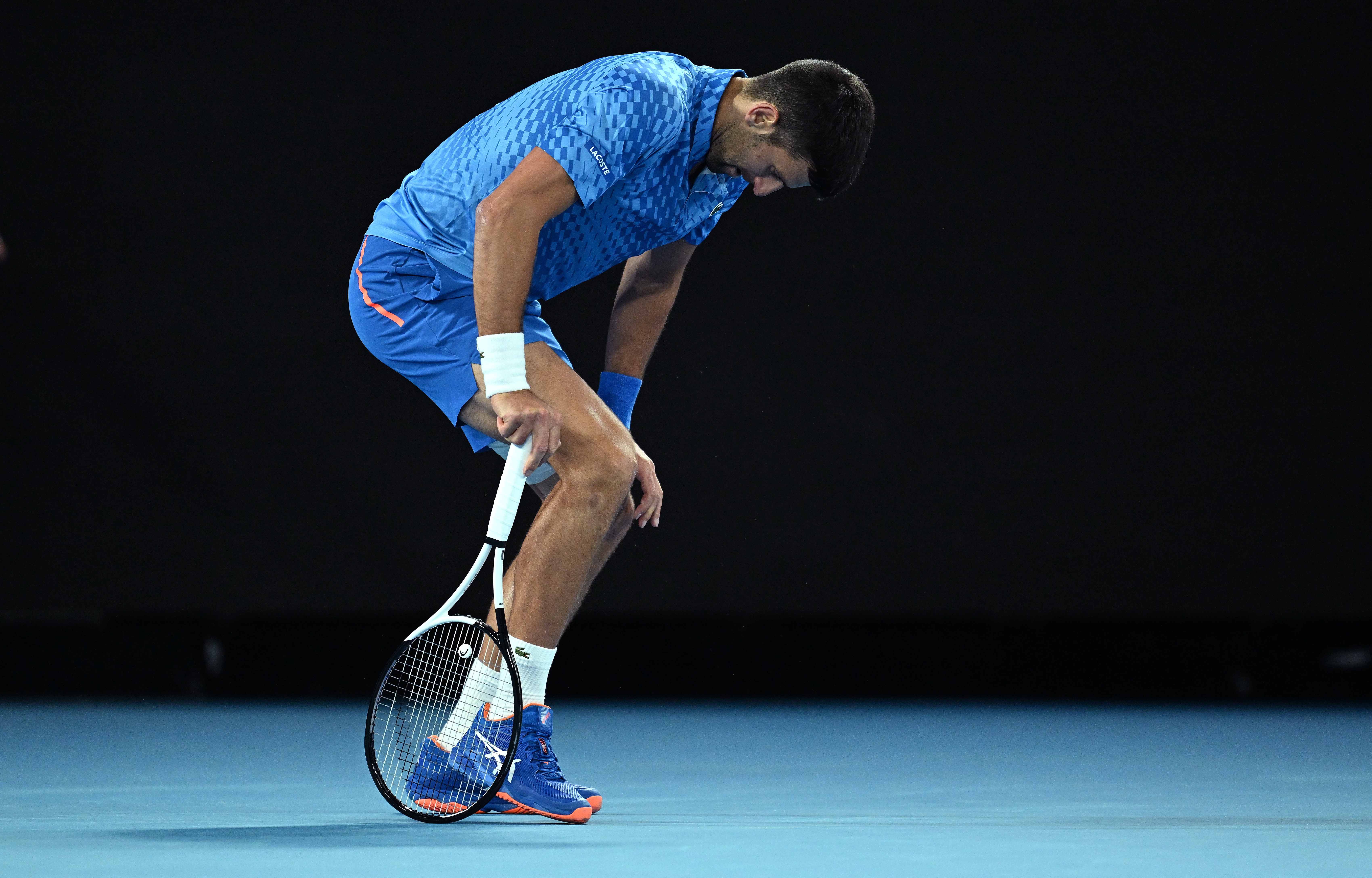 epa10415479 Novak Djokovic of Serbia reacts during his second round match against Enzo Couacaud of France at the 2023 Australian Open tennis tournament in Melbourne, Australia, 19 January 2023.  EPA-EFE/LUKAS COCH  AUSTRALIA AND NEW ZEALAND OUT