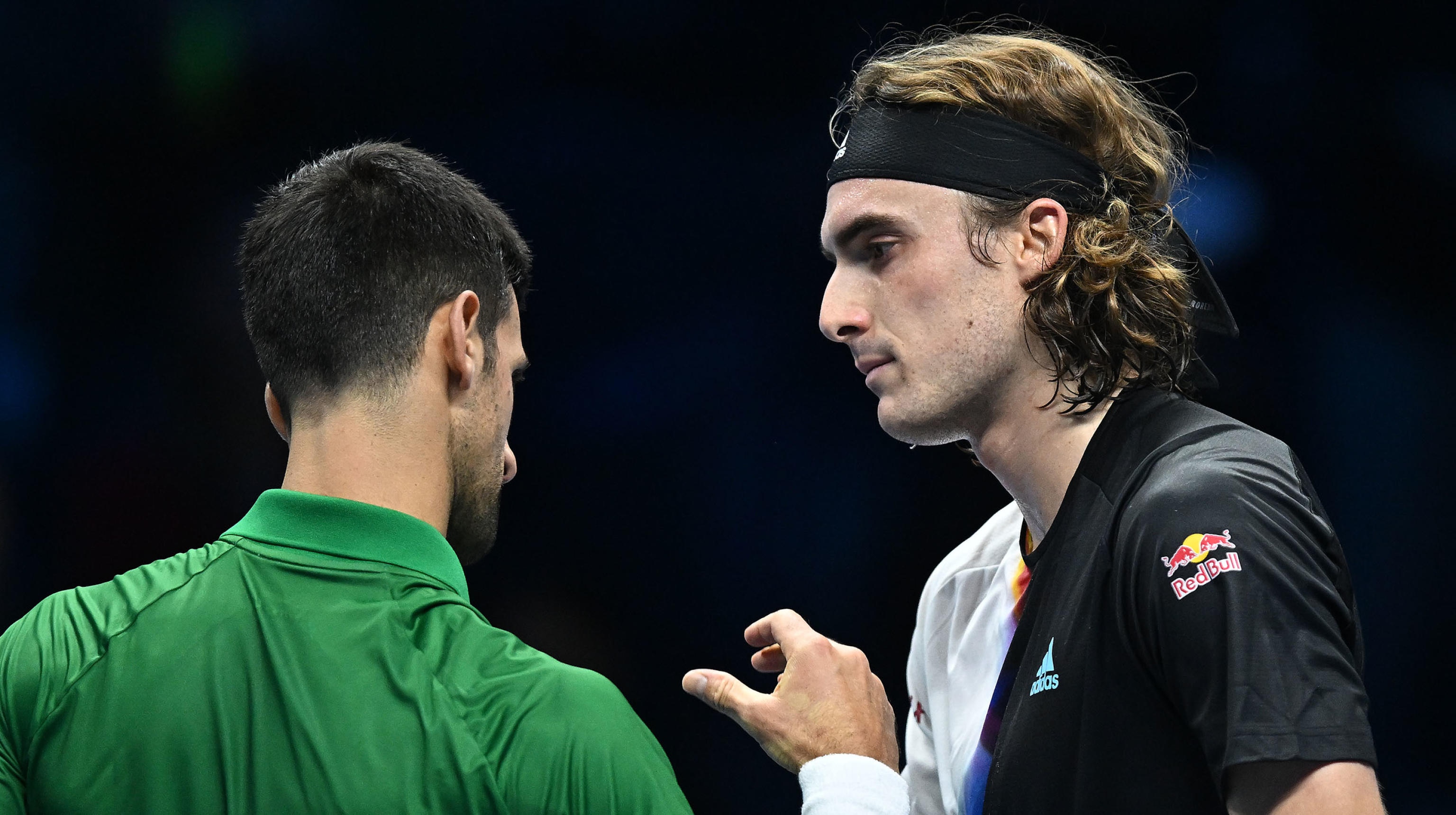 epa10306071 Novak Djokovic of Serbia with Stefanos Tsitsipas of Greece after their match at the Nitto ATP Finals 2022 tennis tournament at the Pala Alpitour arena in Turin, Italy, 14 November 2022.  EPA-EFE/ALESSANDRO DI MARCO