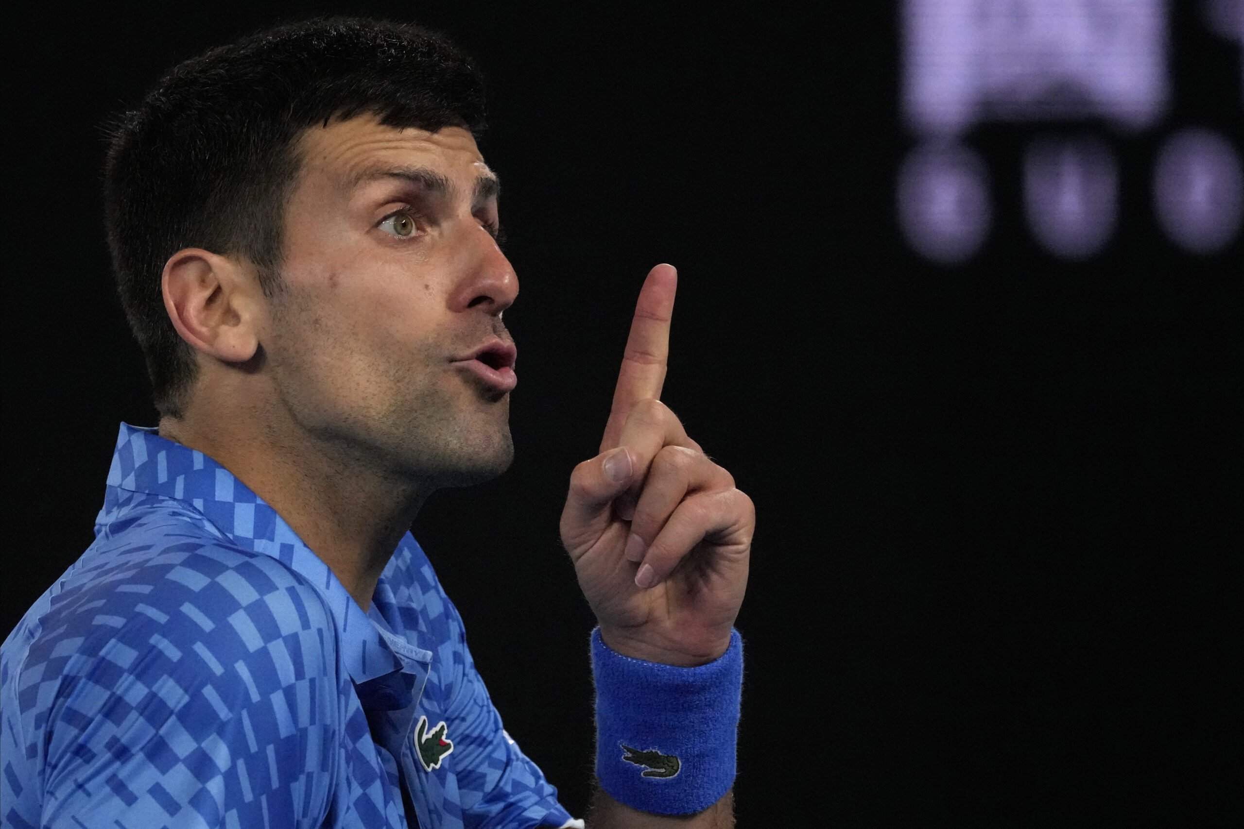 Novak Djokovic of Serbia reacts during his third round match against Grigor Dimitrov of Bulgaria at the Australian Open tennis championship in Melbourne, Australia, Saturday, Jan. 21, 2023. (AP Photo/Aaron Favila)