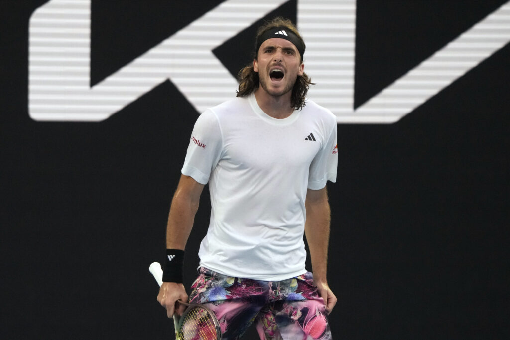 Stefanos Tsitsipas of Greece reacts as he plays against Jannik Sinner of Italy during their fourth round match at the Australian Open tennis championship in Melbourne, Australia, Sunday, Jan. 22, 2023. (AP Photo/Mark Baker)
