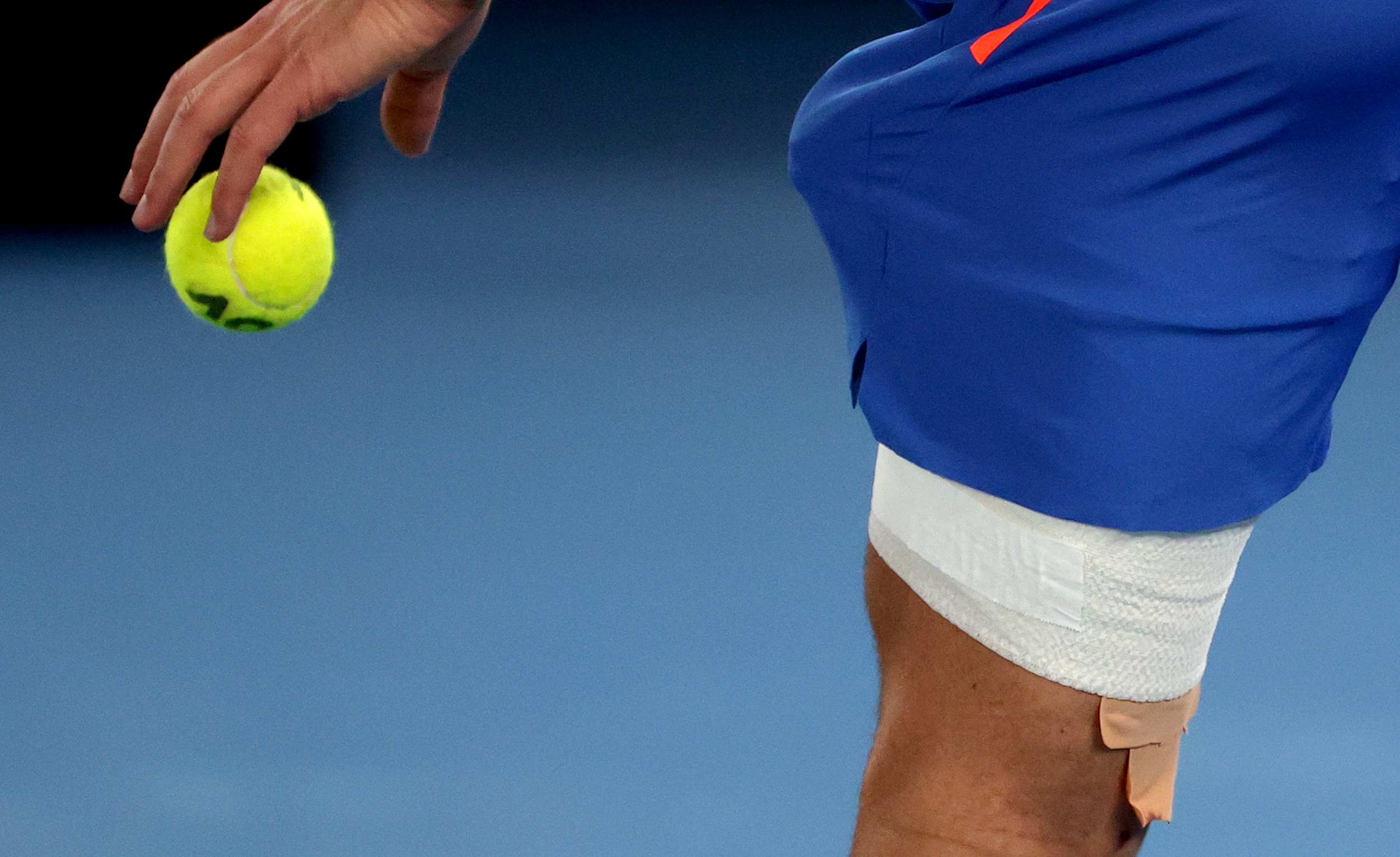 epa10424513 The bandaged left thigh of Novak Djokovic of Serbia during his 4th round match against Alex de Minaur of Australia at the 2023 Australian Open tennis tournament at Melbourne Park in Melbourne, Australia, 23 January 2023.  EPA-EFE/FAZRY ISMAIL