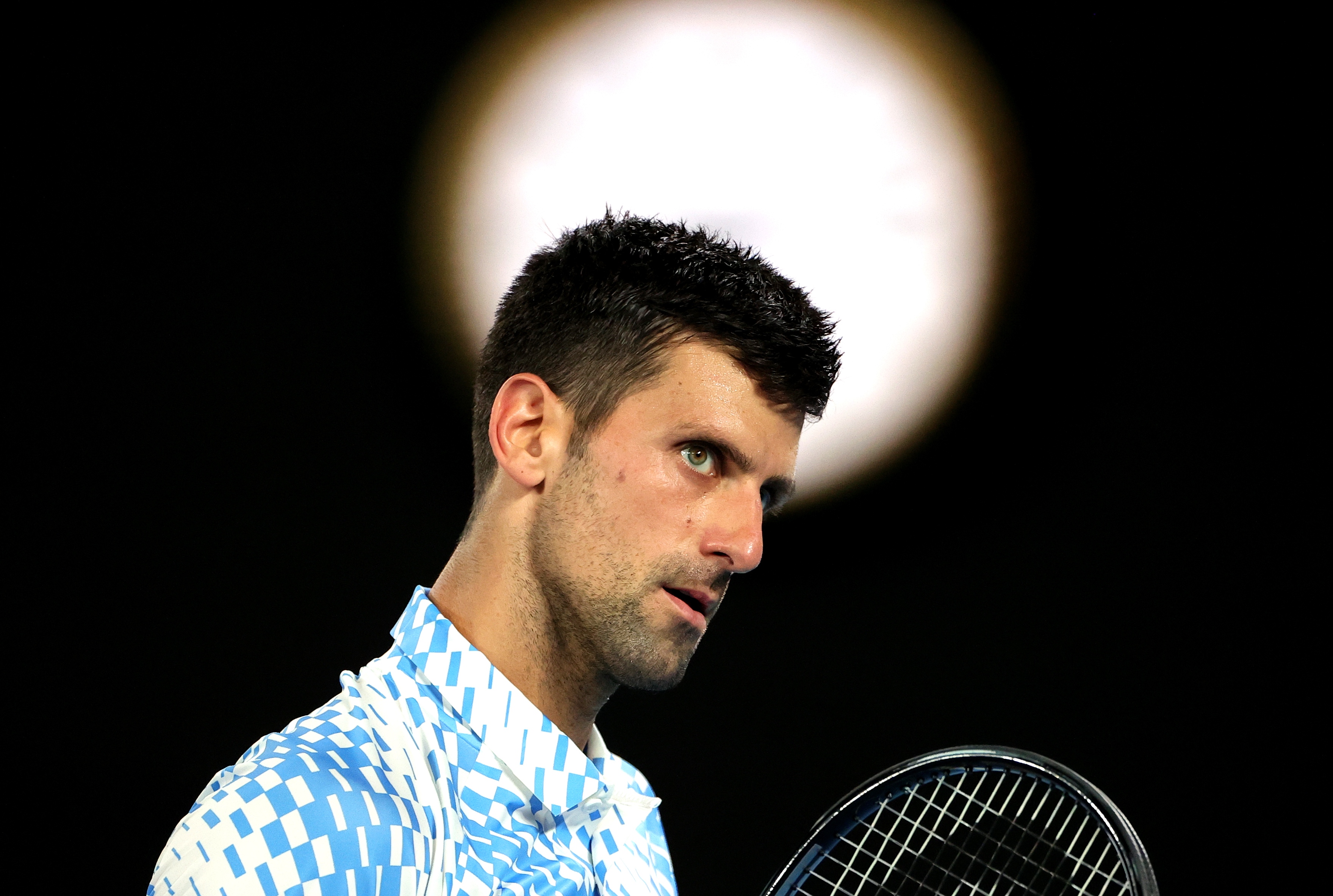 epa10424518 Novak Djokovic of Serbia looks on during his 4th round match against Alex de Minaur of Australia at the 2023 Australian Open tennis tournament at Melbourne Park in Melbourne, Australia, 23 January 2023.  EPA-EFE/FAZRY ISMAIL