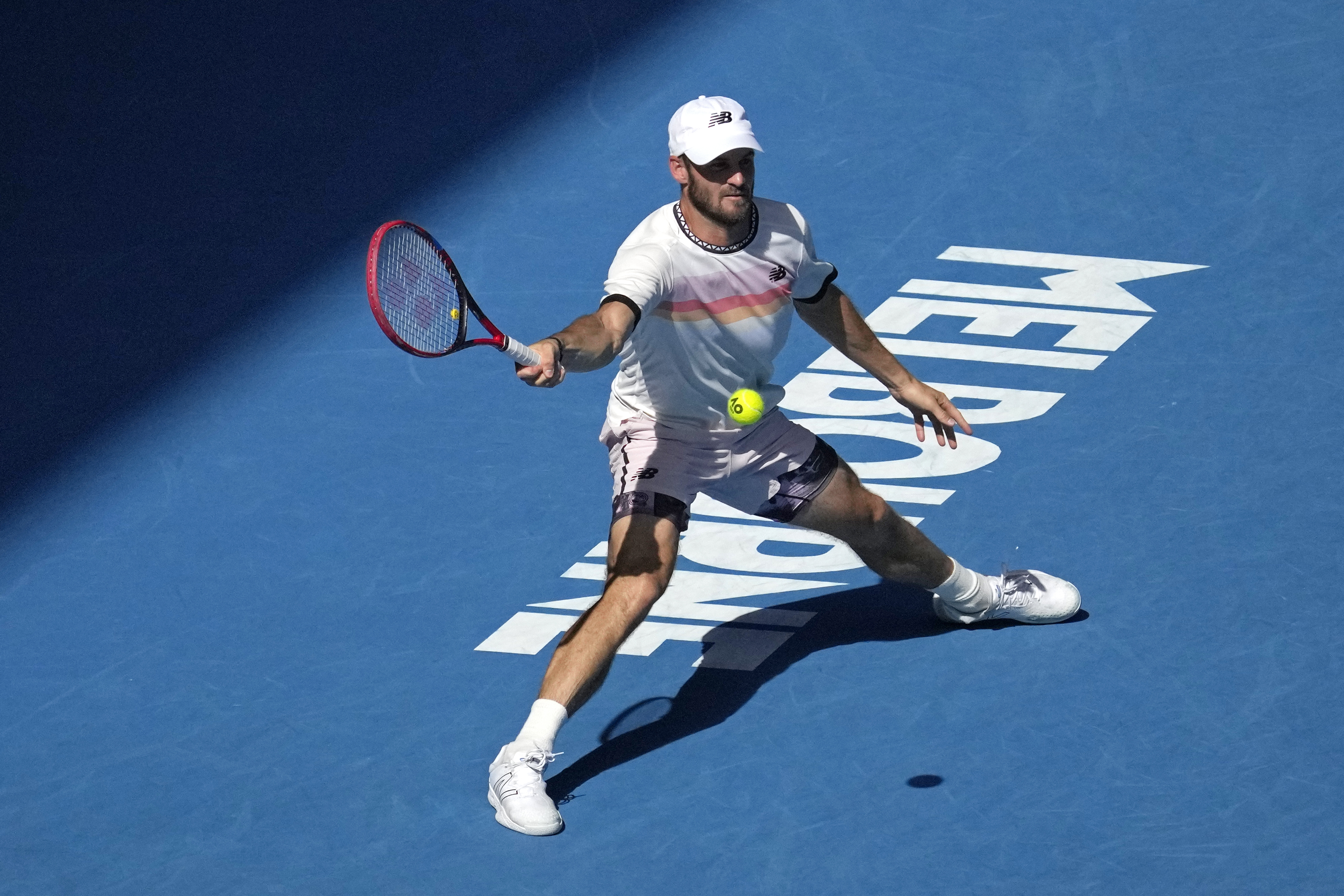 Tommy Paul of the U.S. plays a forehand return to compatriot Ben Shelton during their quarterfinal match at the Australian Open tennis championship in Melbourne, Australia, Wednesday, Jan. 25, 2023. (AP Photo/Dita Alangkara)
