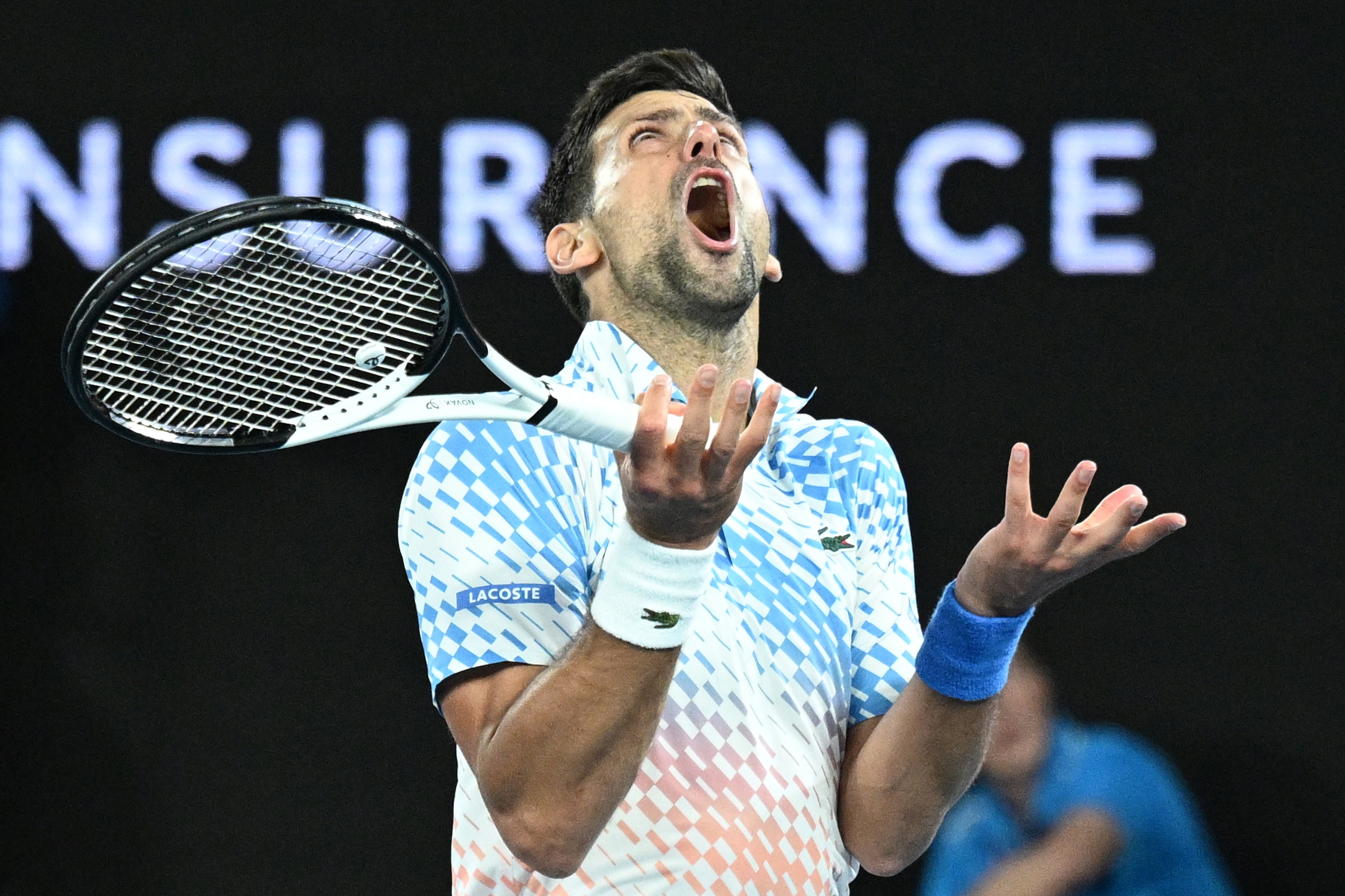 epa10428208 Novak Djokovic of Serbia reacts during his quarterfinal match against Andrey Rublev of Russia at the 2023 Australian Open tennis tournament in Melbourne, Australia, 25 January 2023.  EPA-EFE/JAMES ROSS AUSTRALIA AND NEW ZEALAND OUT