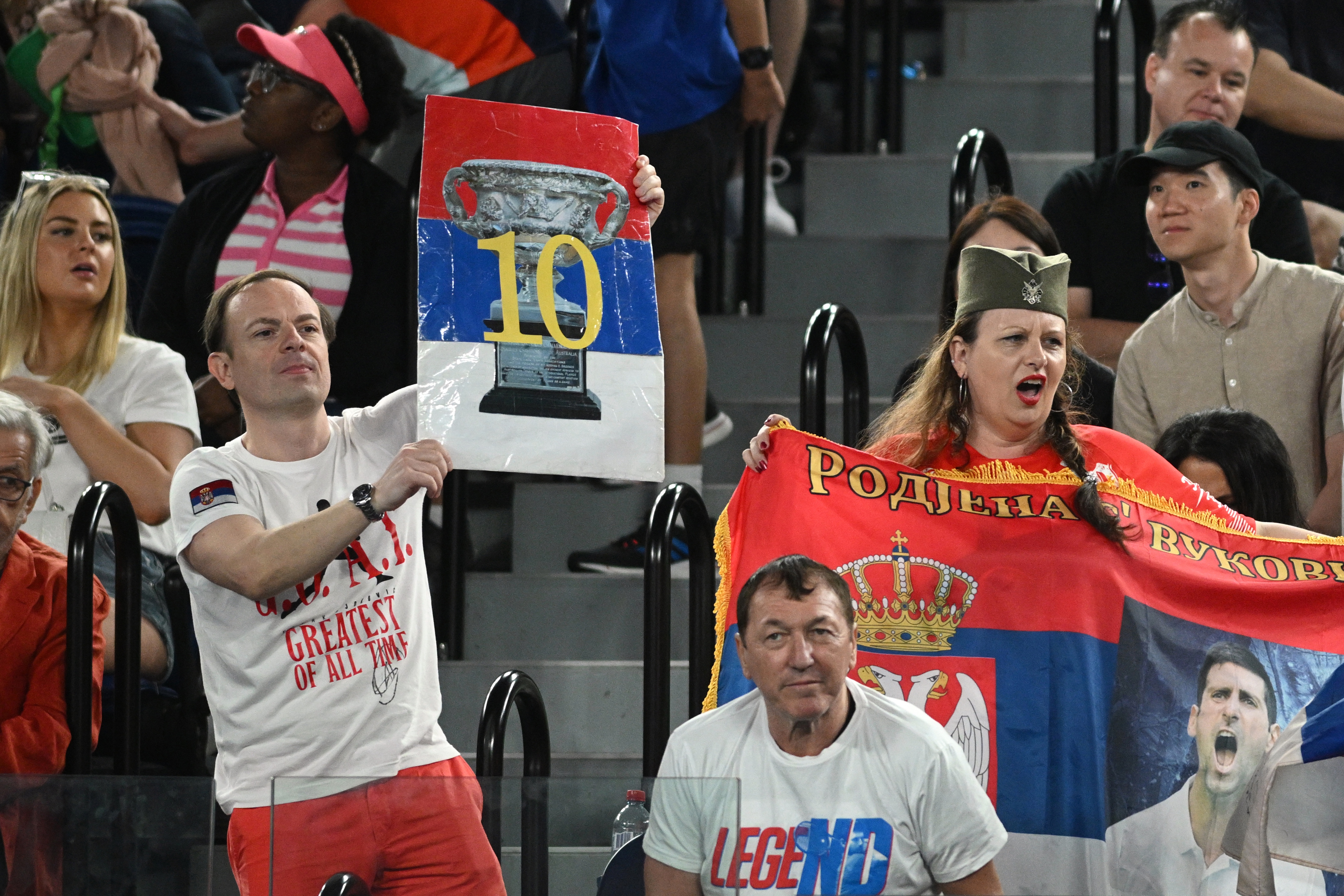 epa10428234 Supporters of Serbia's Novak Djokovic during his quaterfinal match against Andrey Rublev of Russia at the 2023 Australian Open tennis tournament in Melbourne, Australia, 25 January 2023.  EPA-EFE/JAMES ROSS AUSTRALIA AND NEW ZEALAND OUT