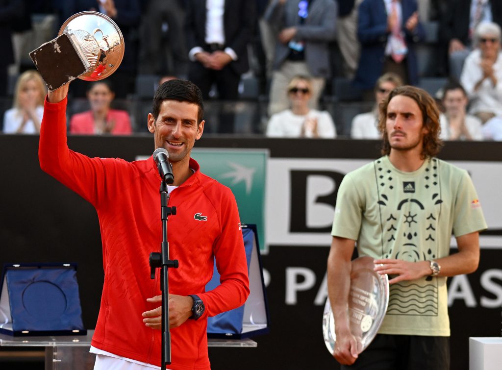 epa09949405 Novak Djokovic (L) of Serbia poses with the trophy after winning his men's singles final match against Stefanos Tsitsipas (R) of Greece at the Italian Open tennis tournament in Rome, Italy, 15 May 2022.  EPA-EFE/ETTORE FERRARI