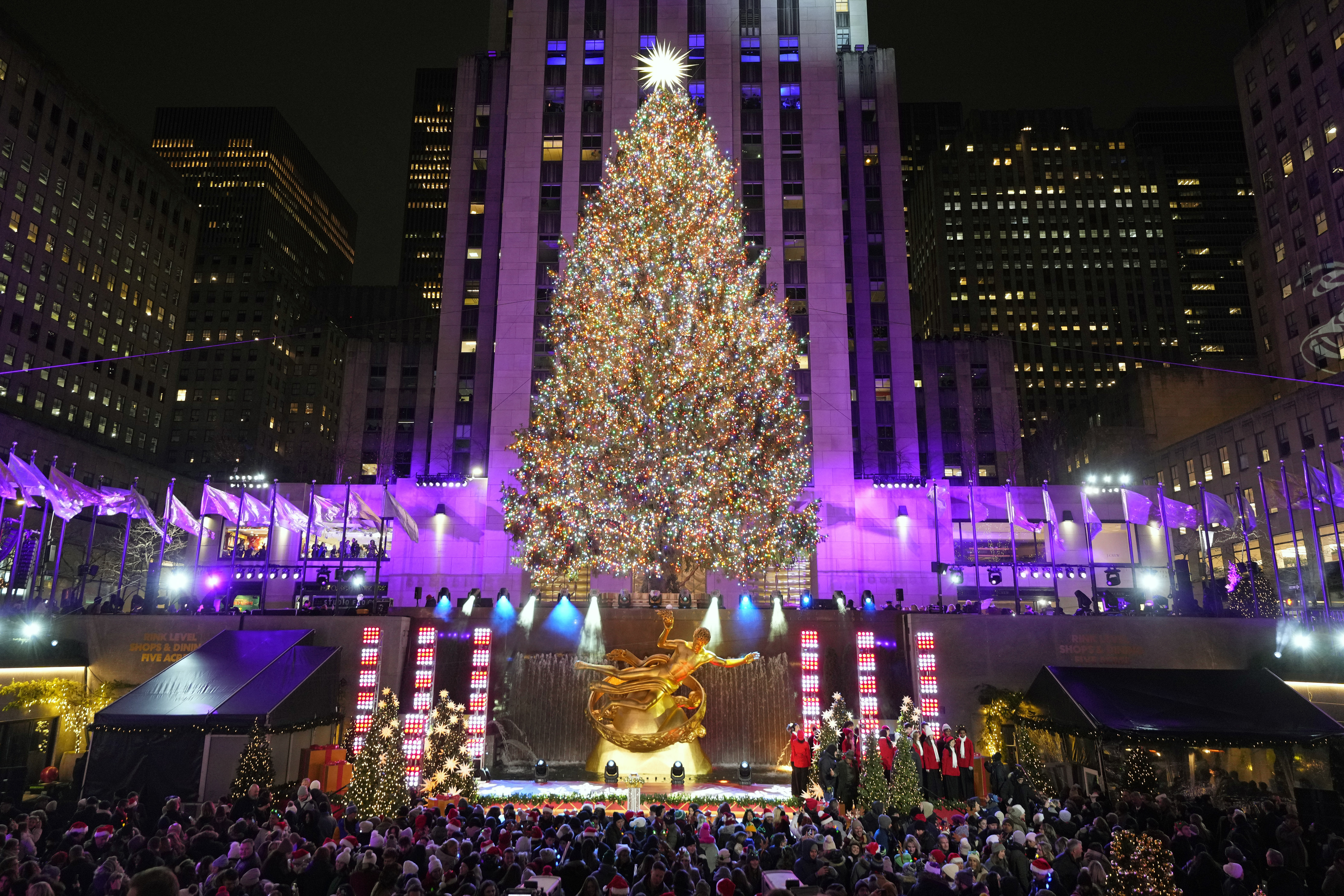 The Rockefeller Center Christmas tree is lit on Wednesday, Nov. 29, 2023, in New York. (Photo by Charles Sykes/Invision/AP)