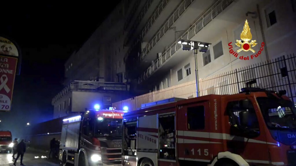 Italian Firefighters vehicles are parked outside the San Giovanni Evangelista Hospital after a fire broke out causing the death of four people in Tivoli, Italy, Friday, Dec. 8, 2023. (Italian Firefighters Via AP)