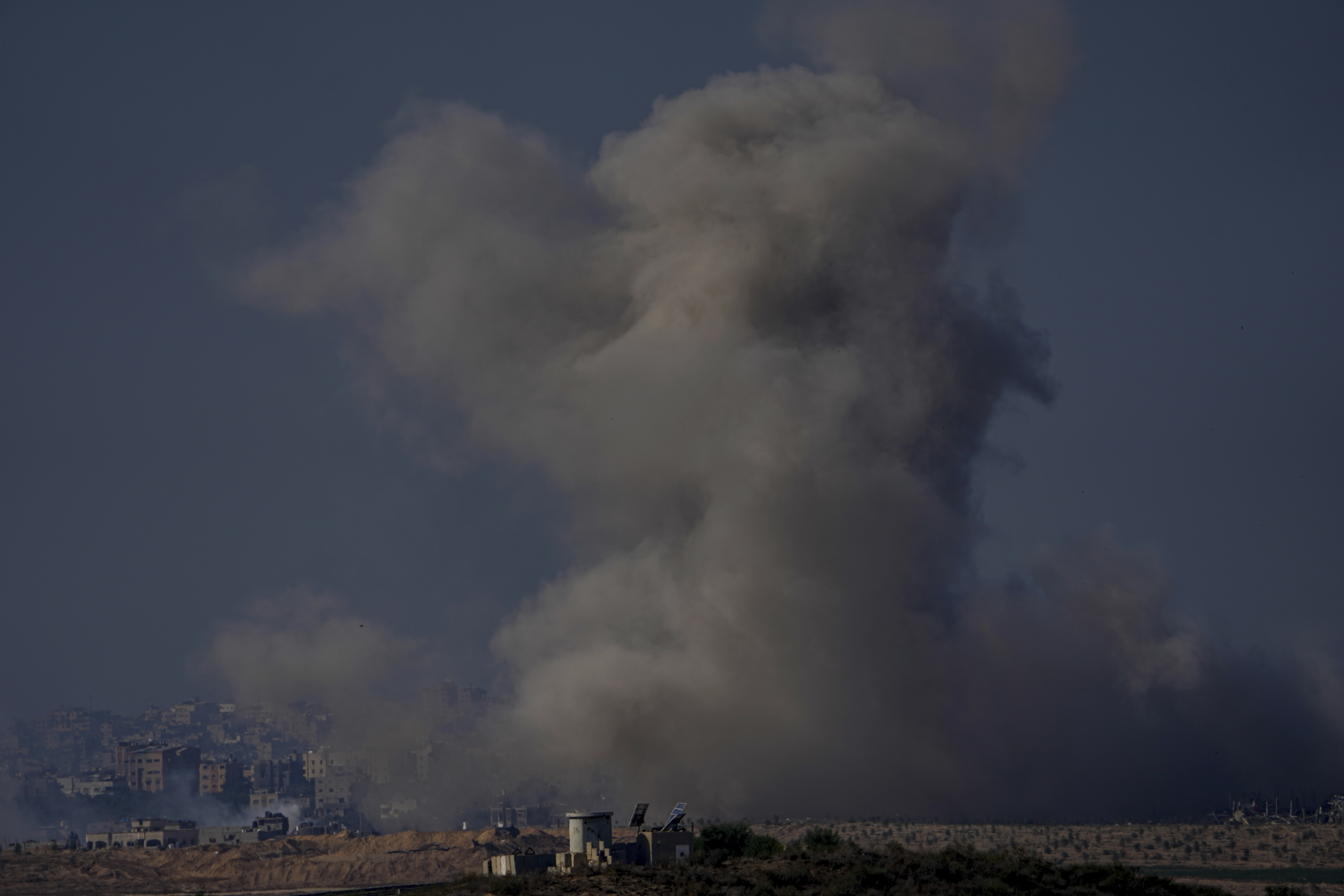 Smoke rises following an Israeli airstrike in the Gaza Strip, as seen from southern Israel, Friday, Dec. 1, 2023. (AP Photo/Ariel Schalit)