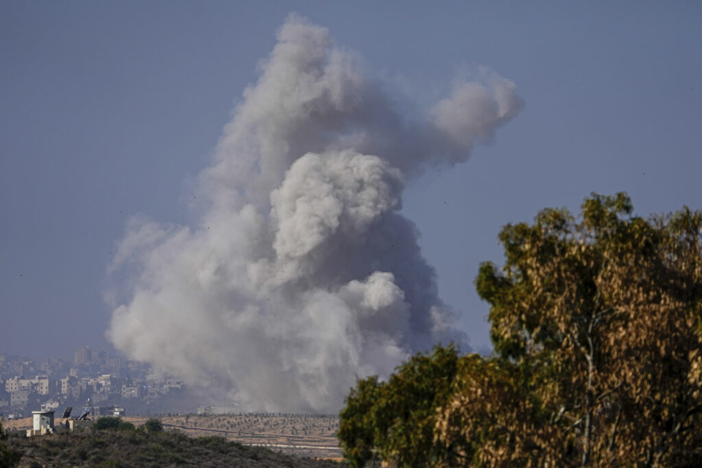 Smoke rises following an Israeli airstrike in the Gaza Strip, as seen from southern Israel, Friday, Dec. 1, 2023. (AP Photo/Ariel Schalit)