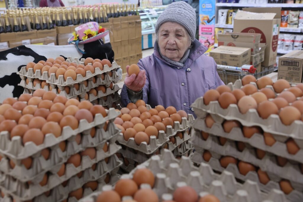 RUSSIA, DONETSK - DECEMBER 12, 2023: A woman shops for eggs at the Gerkules MOLOKO supermarket. Dmitry Yagodkin/TASS,Image: 828790470, License: Rights-managed, Restrictions: , Model Release: no, Credit line: Dmitry Yagodkin / TASS / Profimedia